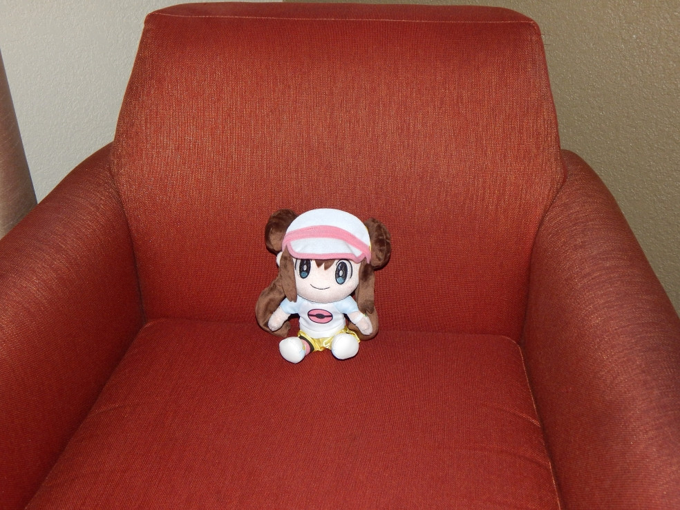 Rosa plush sitting in a chair.