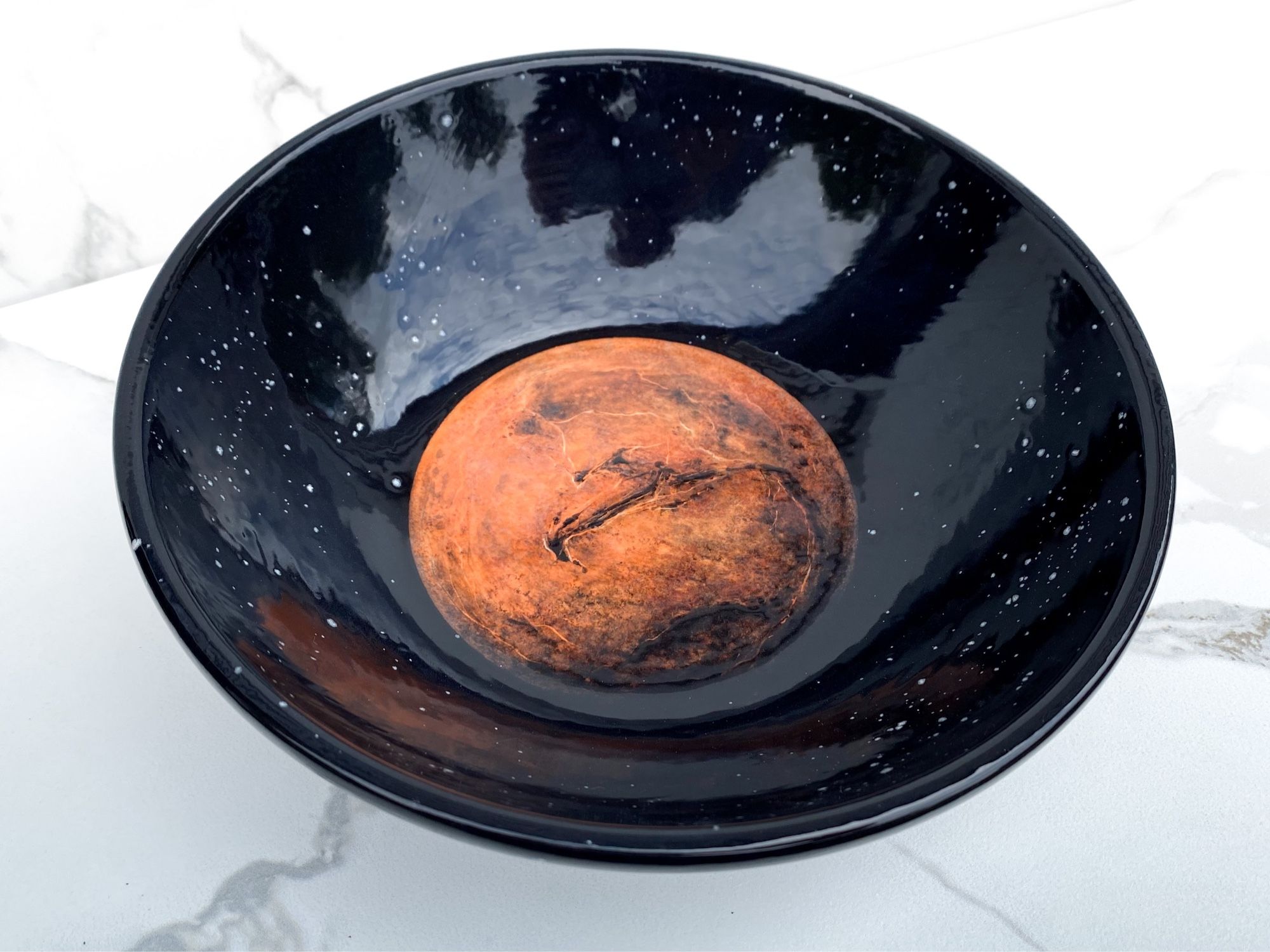 Bowl featuring Mars surrounded by stars 