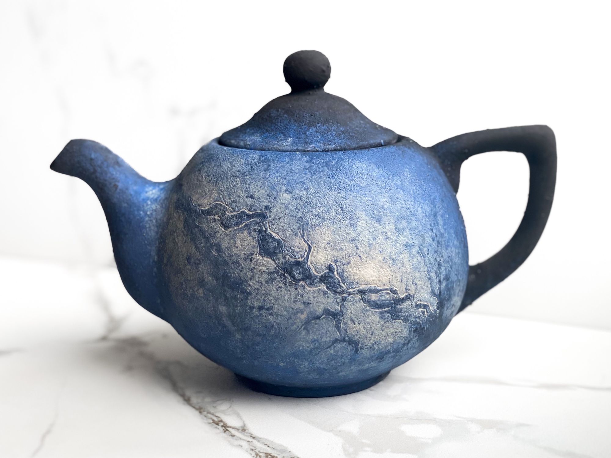 Teapot that features soft view of Milky Way galaxy.