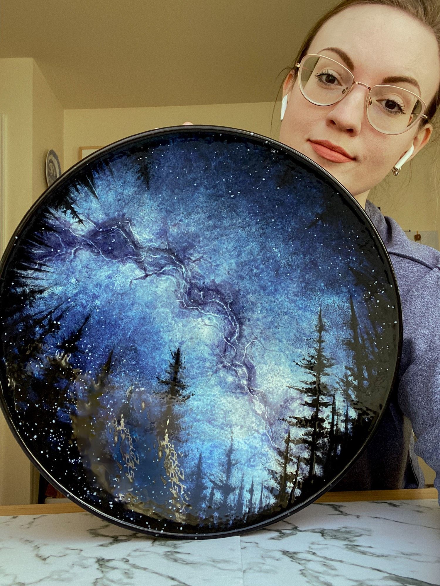 Me behind a large serving bowl featuring the Milky Way surrounded by a ring of trees