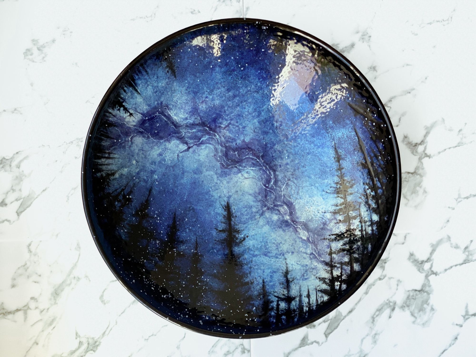 Serving bowl featuring the Milky Way surround by a ring of trees.