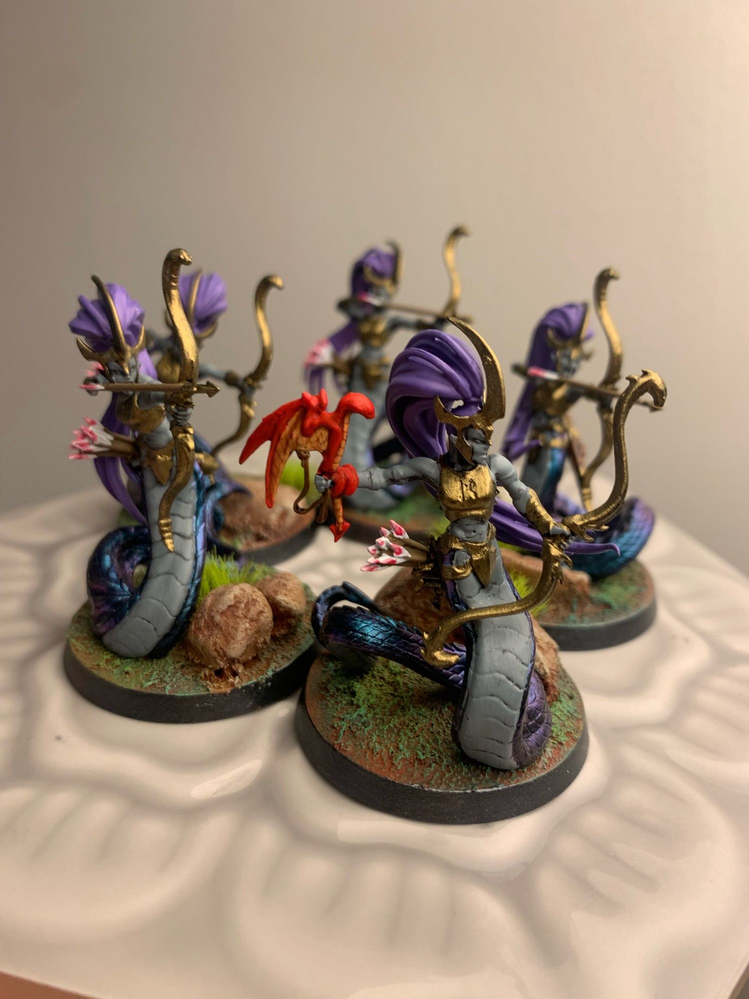 5 age of Sigmar snake ladies with bows. This color scheme paints quickly, but I don’t think I can translate it to the entire Daughters of Khaine line.