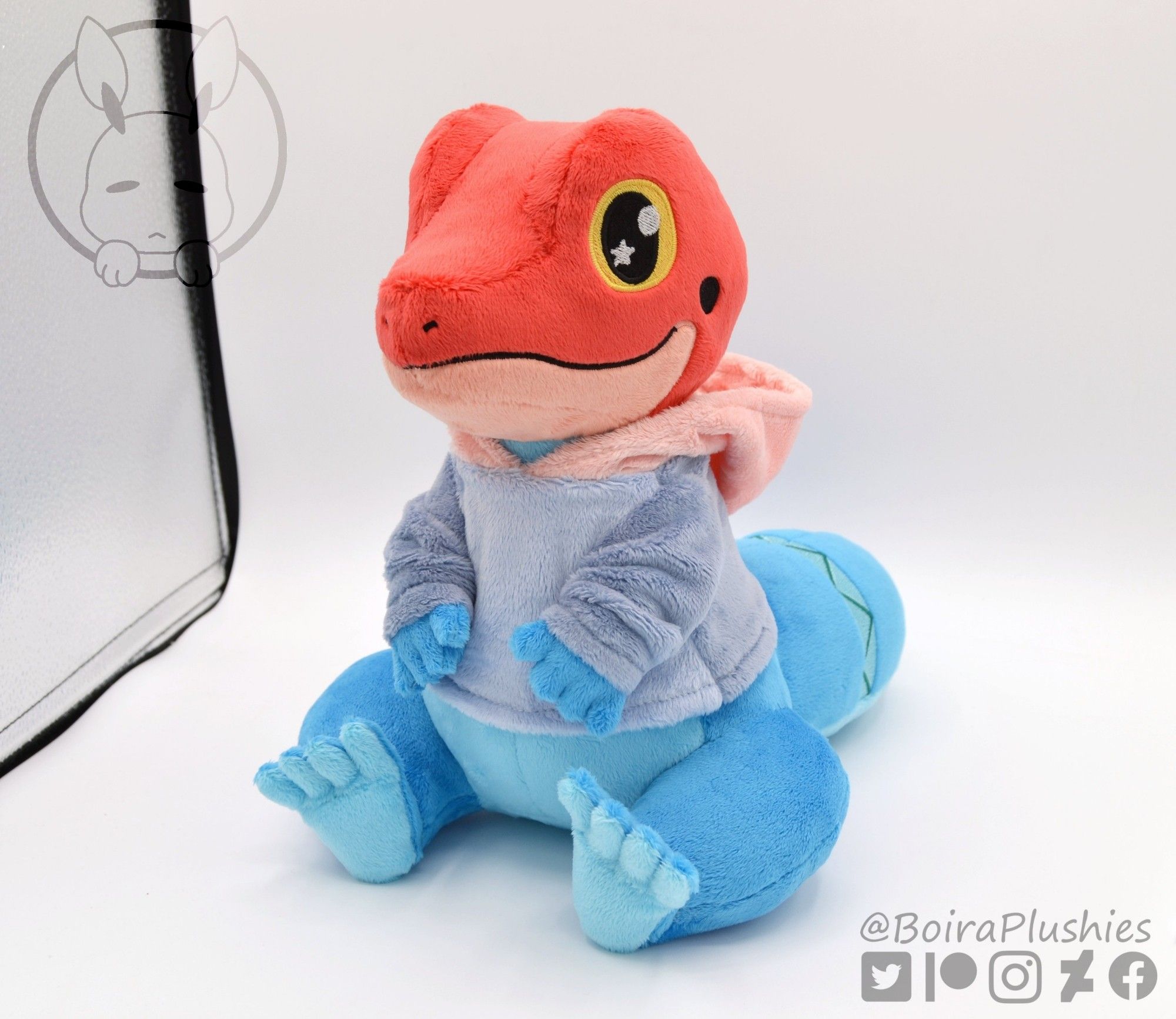 Handmade lizard plush with a hoodie. Red and blue colors