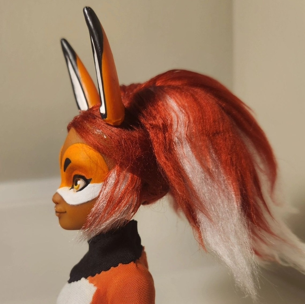 All four photos are angles of a custom Rena Rouge doll from Miraculous Ladybug. She is a superhero with red and white hair and a orange, white, and black costume like a fox.