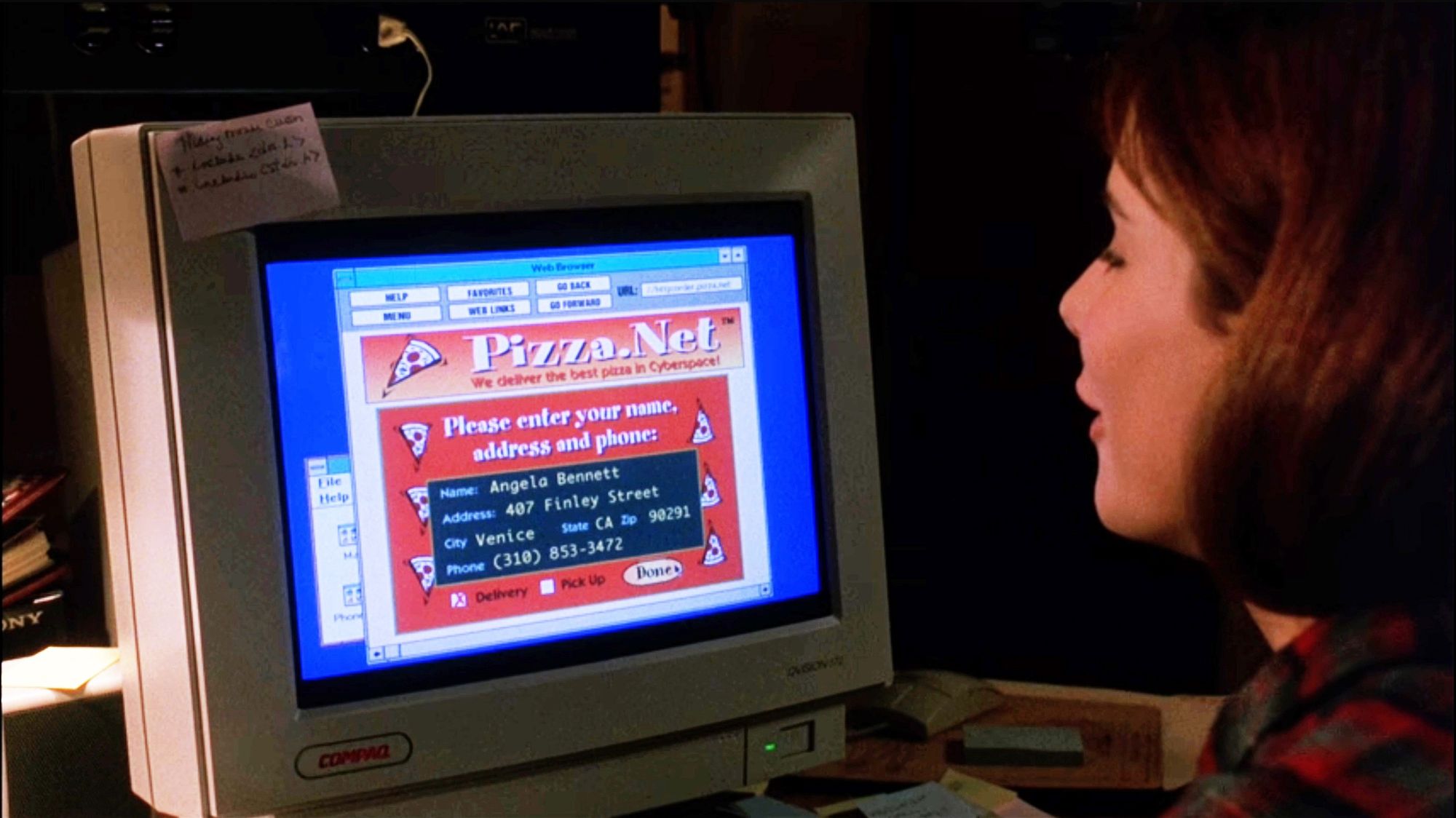 a scene from the The Net (1995) in which Sandra Bullock is ordering dinner from the Pizza dot net website.