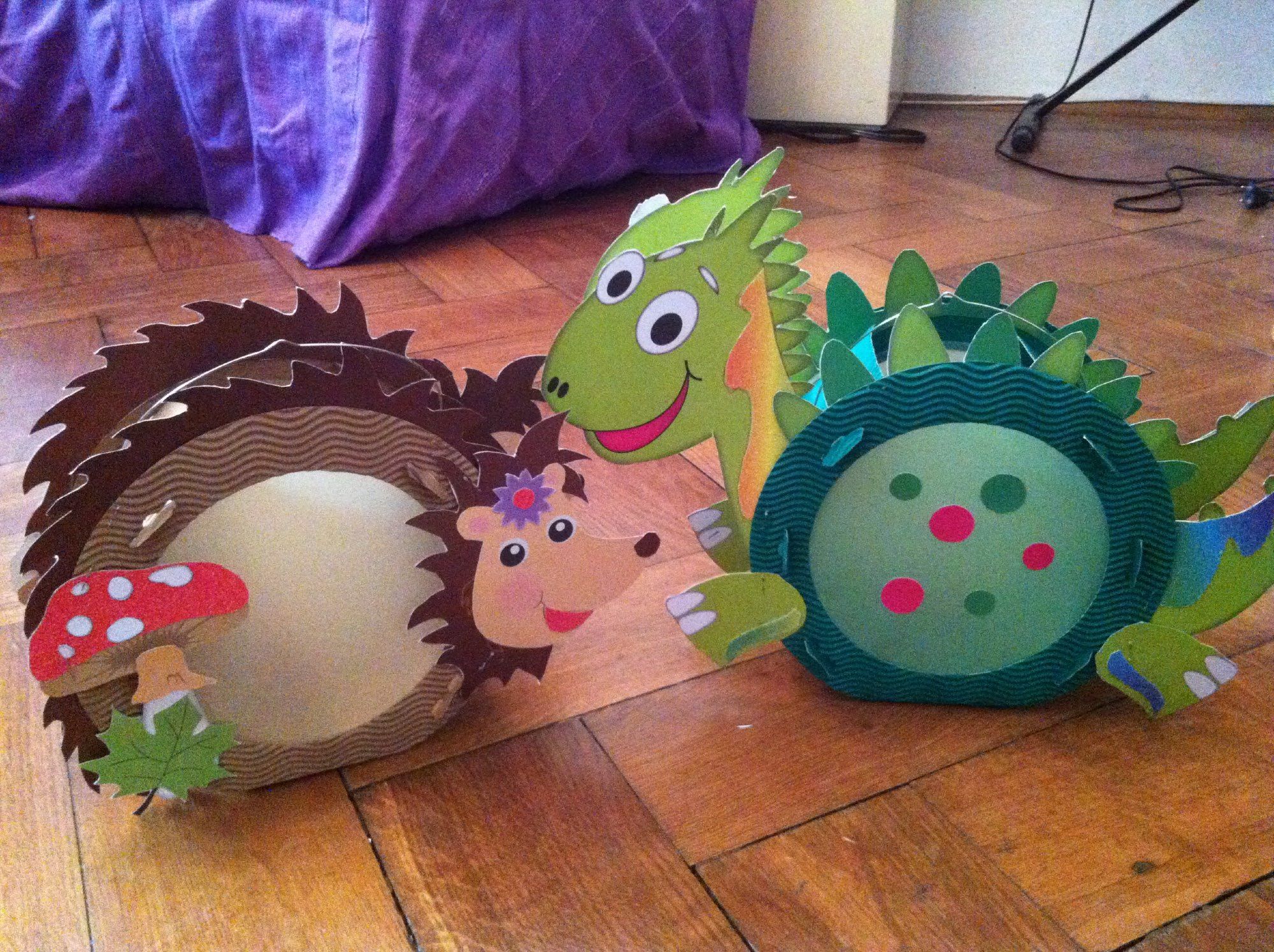 St. Martin lanterns in form of an hedgehog and a dragon, made with lots of glue and mother's tears and of course real candles, because what would St. Martin be without the thrill of toddlers carrying open fires in a bowl of dry paper?