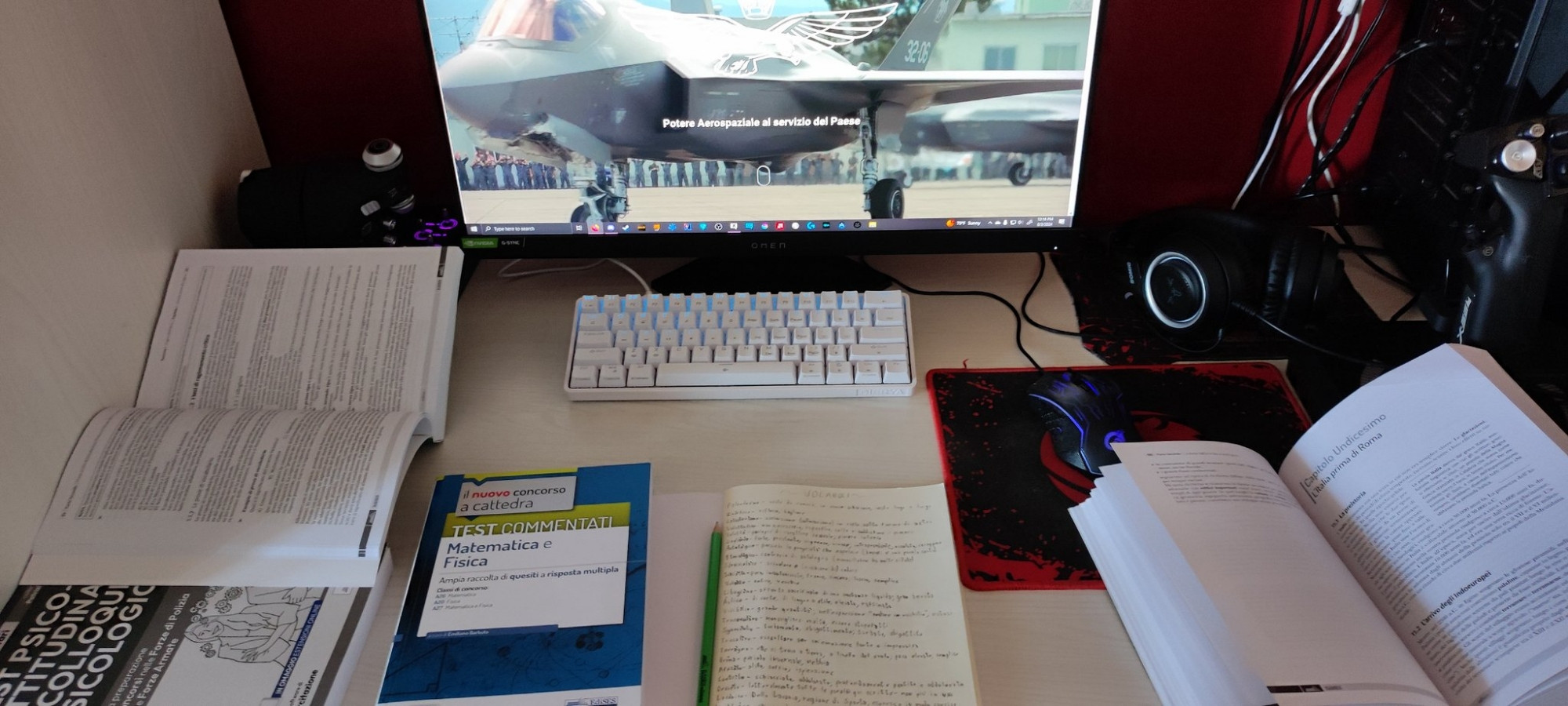 My desk, filled with books and notebooks, related to my studies to join the air force.