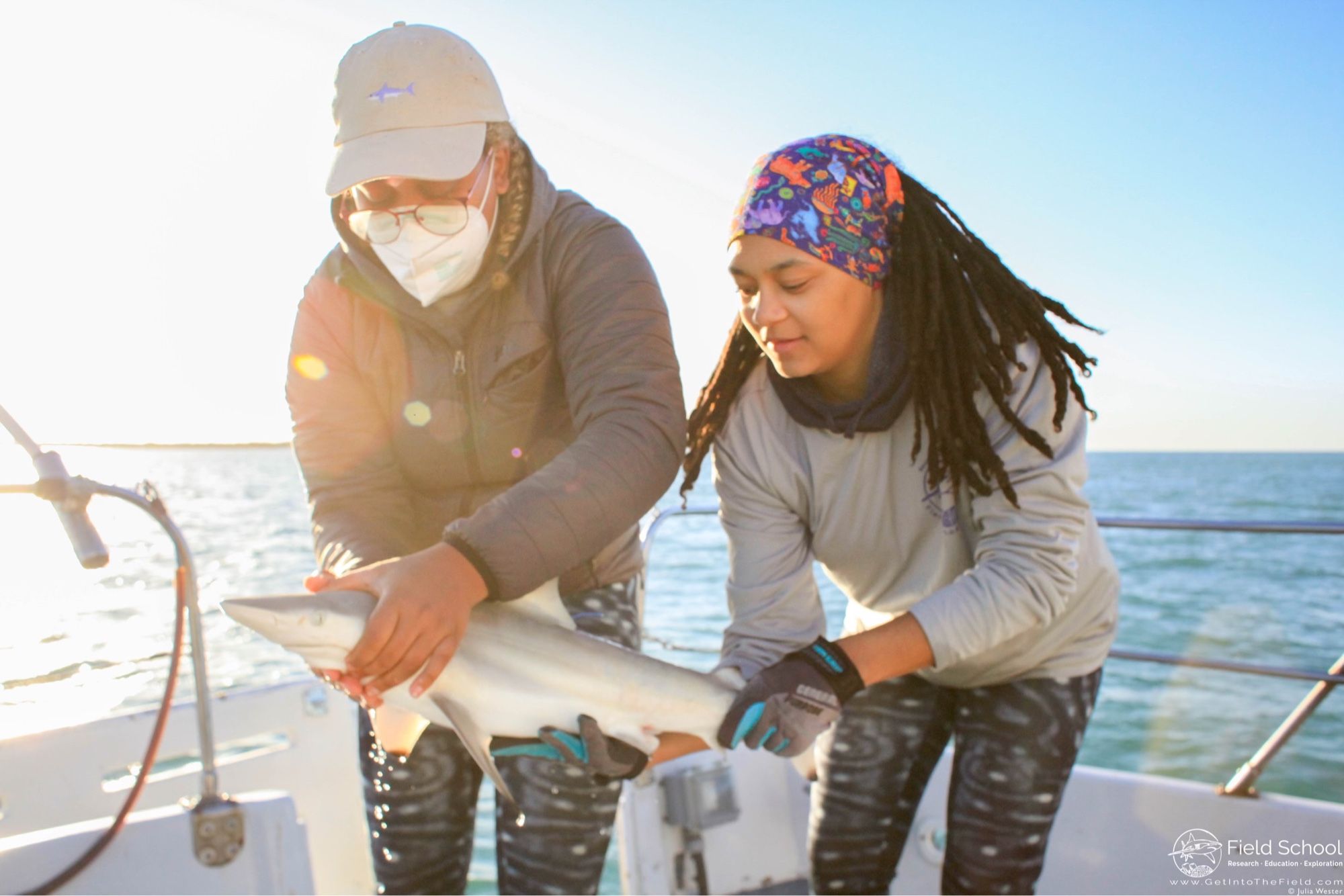 Jaida and fellow MISS cofounder Amani returning a shark to the water