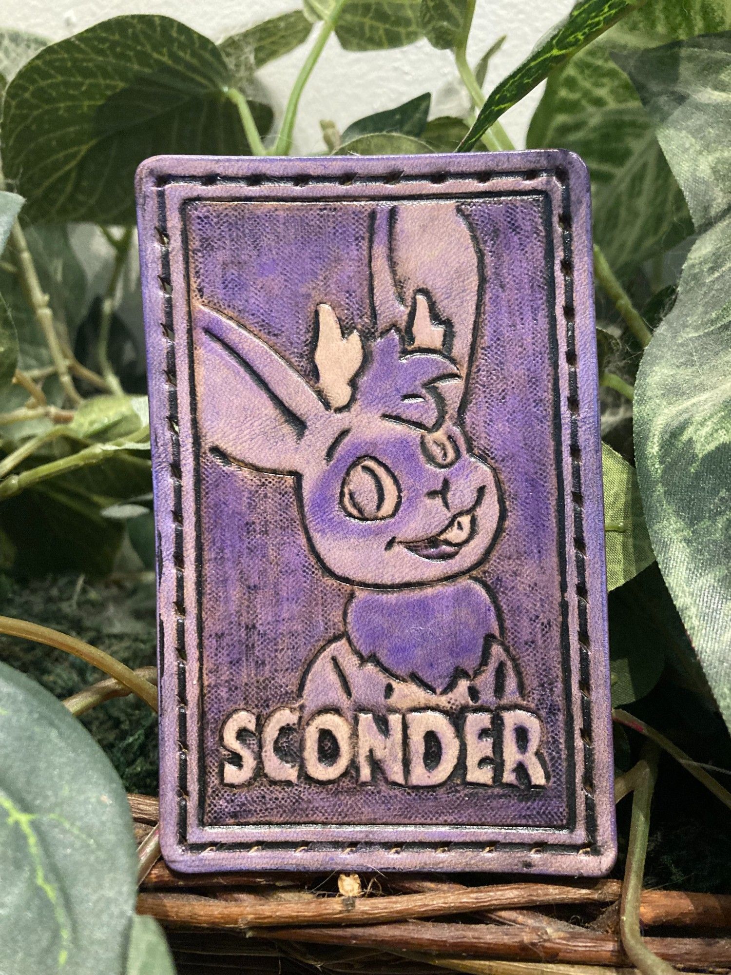 Purple leather patch featuring a jackalope and the text "SCONDER"