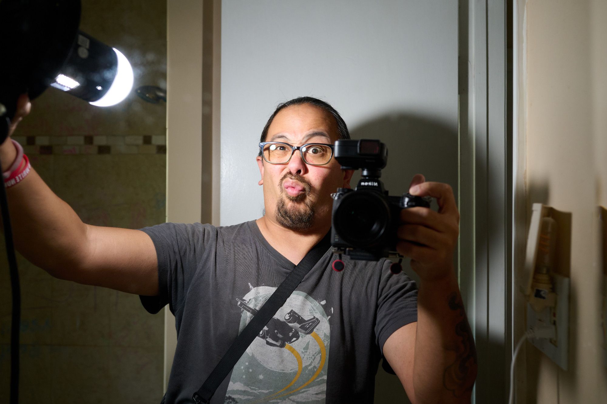 Another mirror selfie. This time, the hand held flash has a small dome diffuser instead of the soft box.