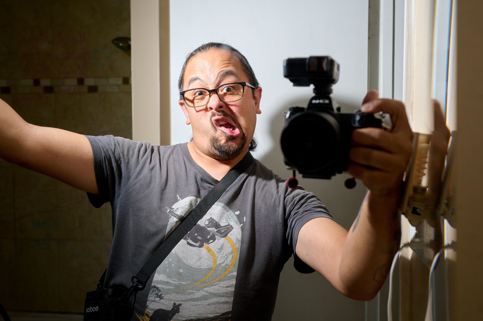 Another mirror selfie. The hand held flash is out of frame while my other hand is holding my camera. I'm making a weird face.