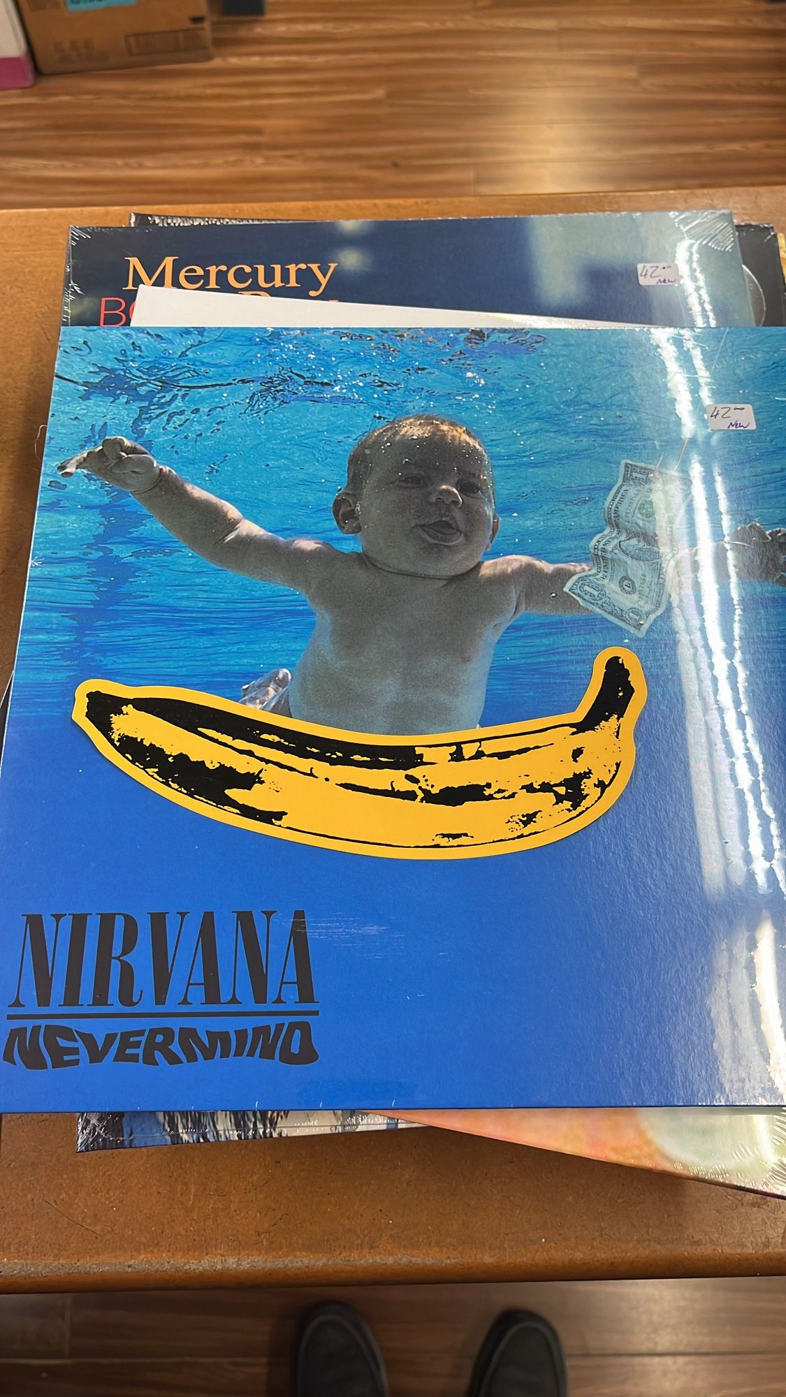 Nirvana’s Nevermind album cover with Andy Warhol’s Banana from Velvet Underground covering the babies’ weenie.