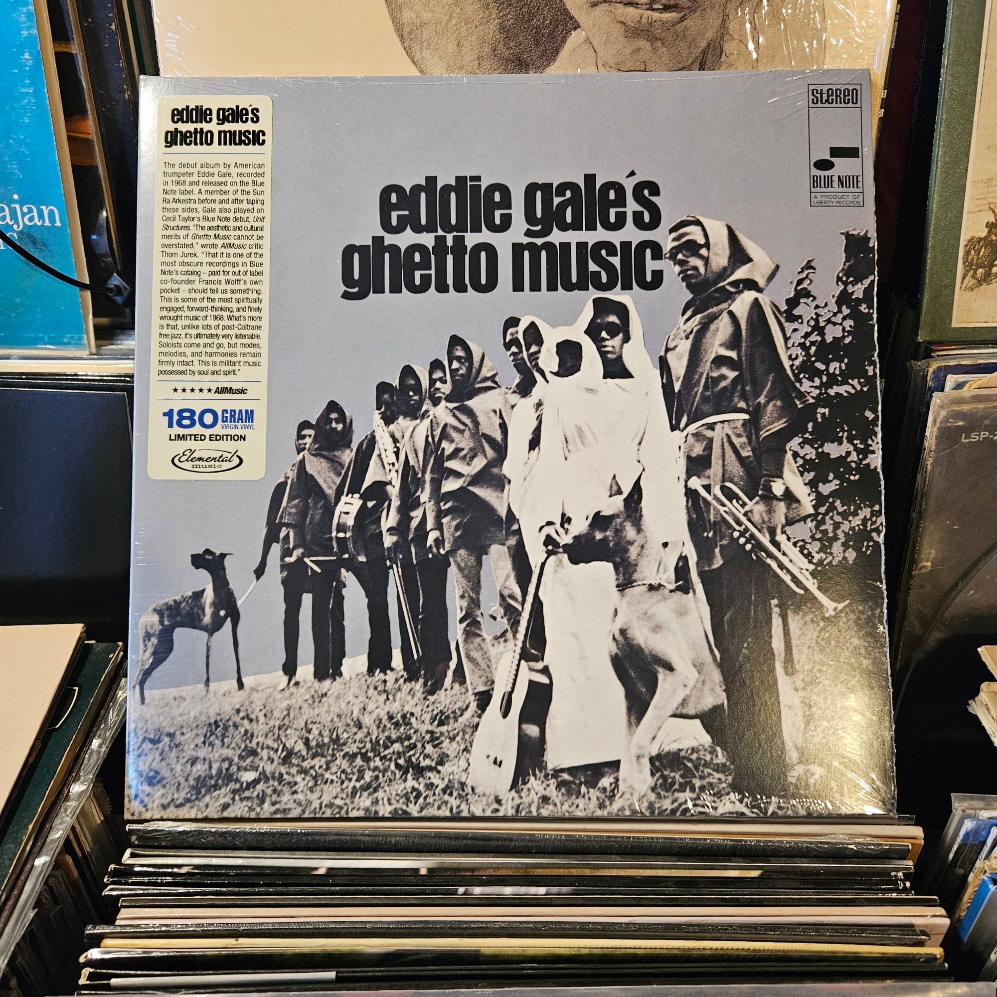 Album cover features a black and white photograph of Eddie Gale and nine other musicians, dressed in robes with hoods over their heads, holding instruments, standing in a grassy outdoor setting.  They have a couple of amazing looking dogs on leashes with them - brindle coated Great Danes by the look of it.