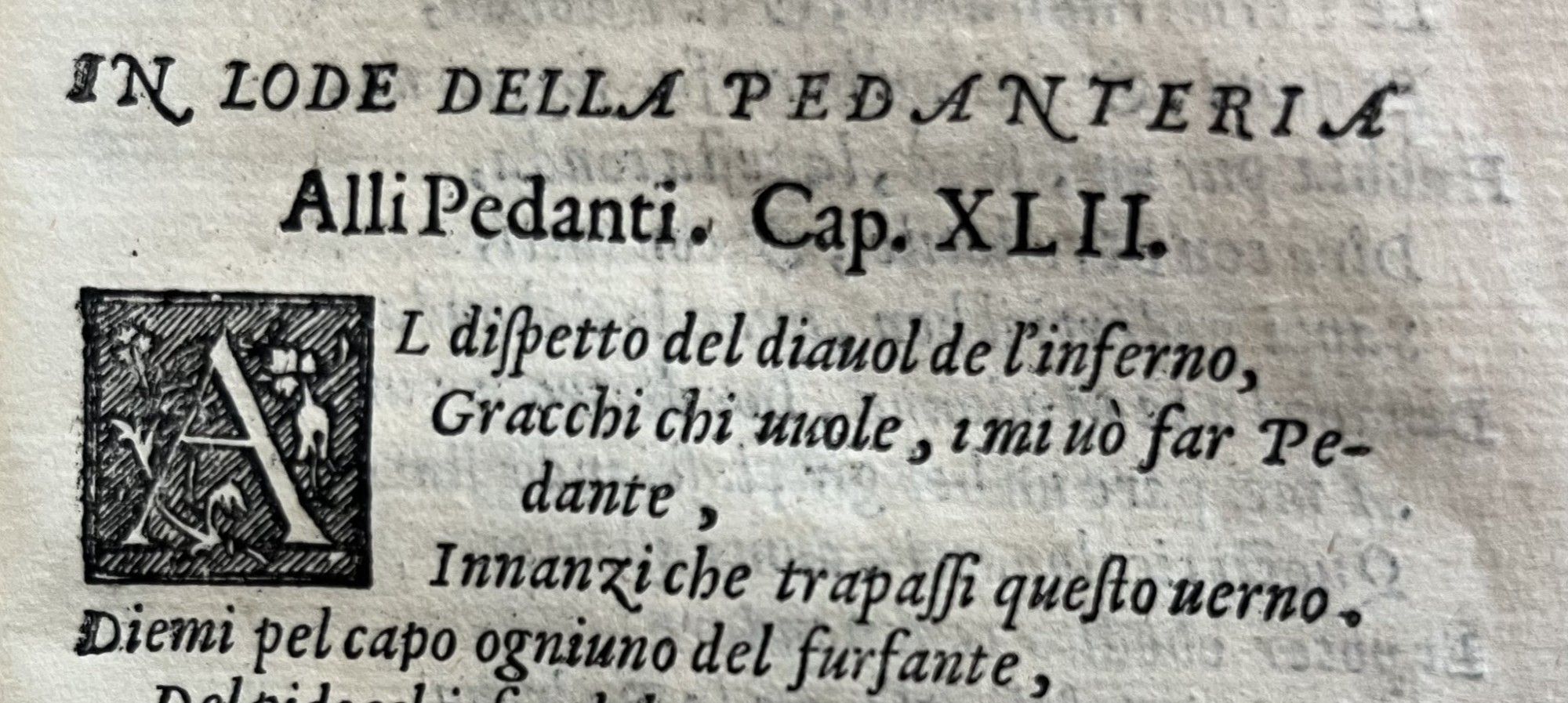 Printed poetry, with the heading "In lode della pedanteria" and "Alli pedanti, cap XLII"