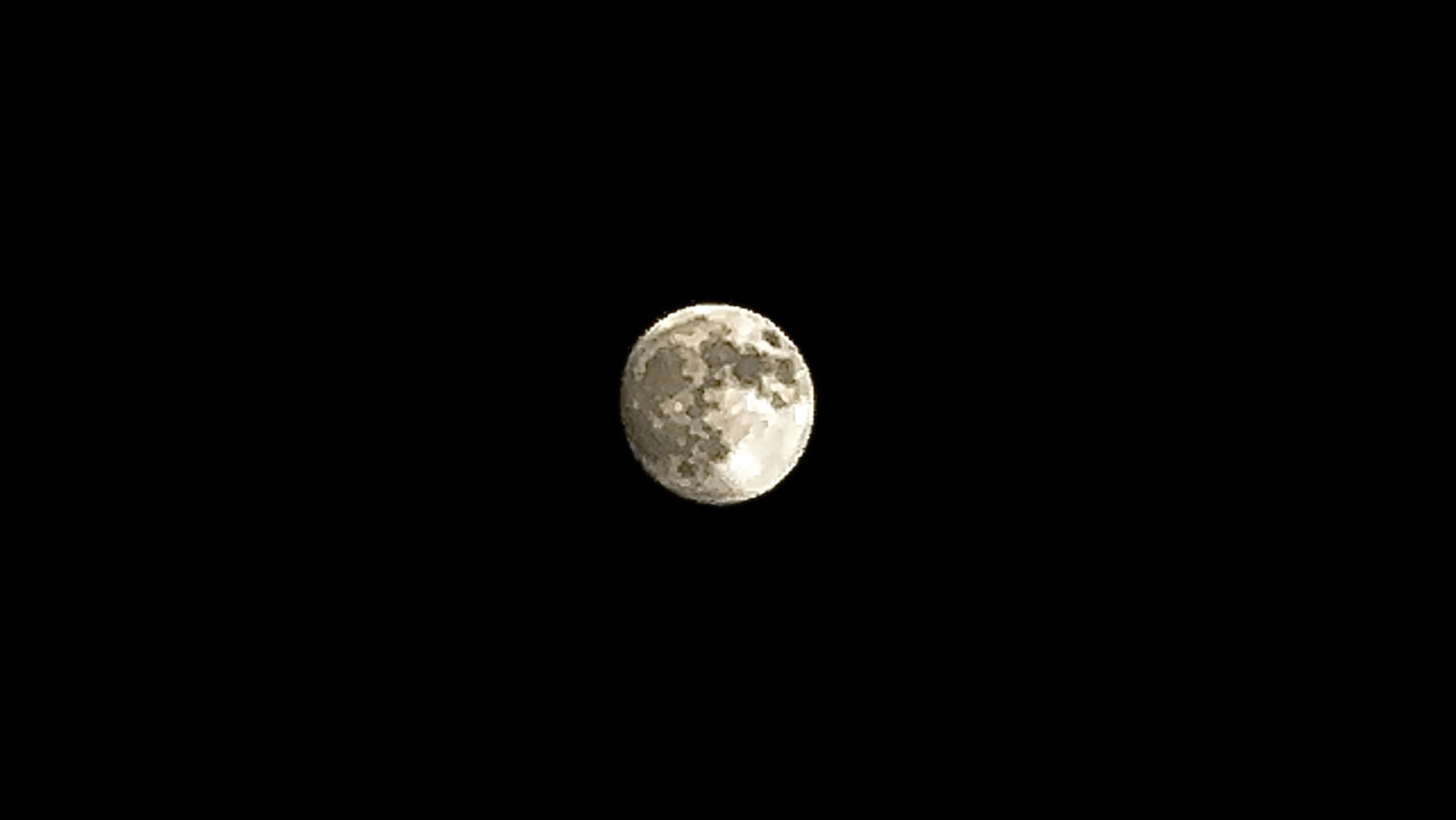 A picture of the moon from my iPhone, using a new technique I learned that has me buzzing. You can see details of her surface.