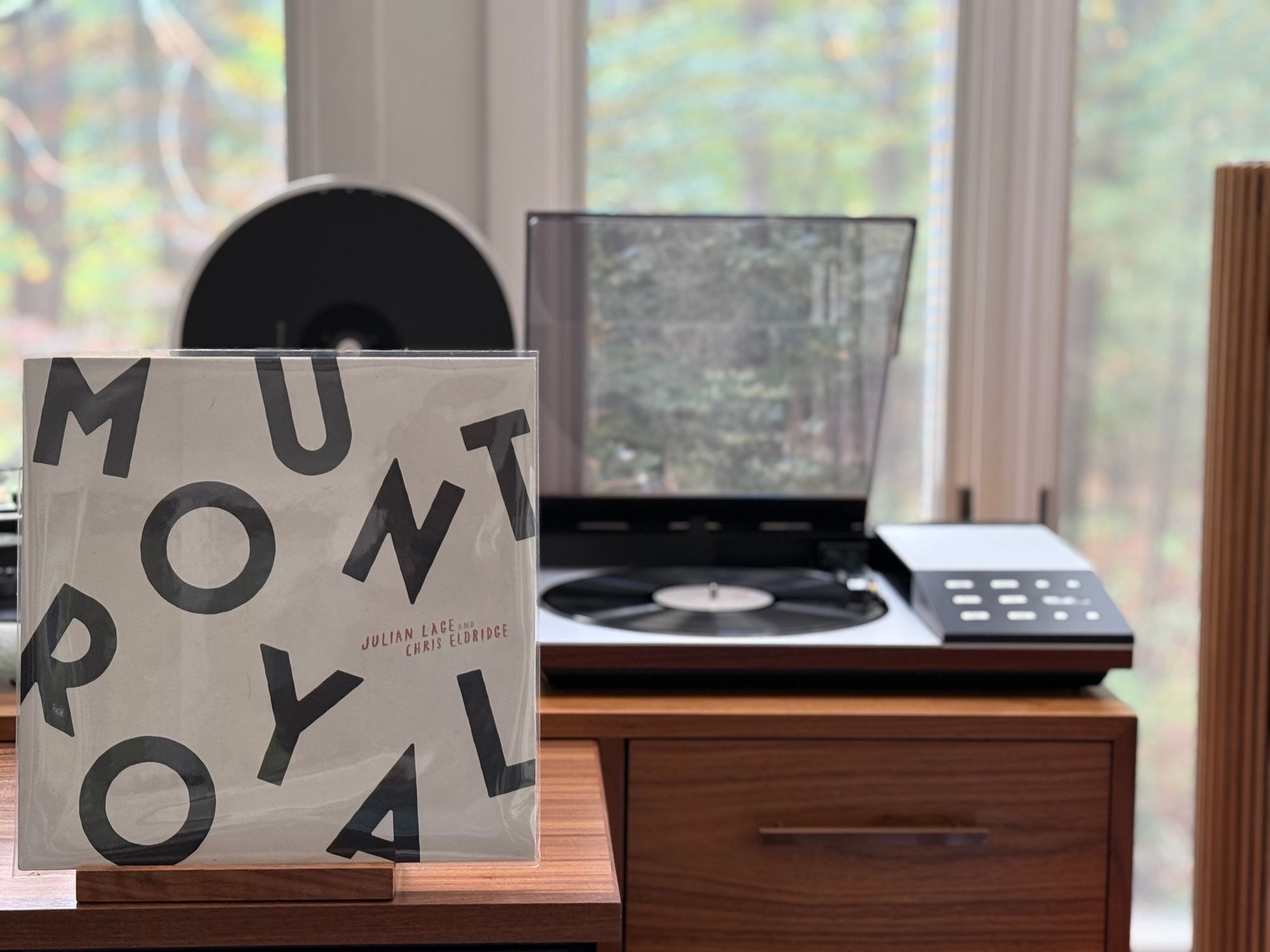 Julian Lage & Chris Eldridge -Mount Royal LP cover.

The title in black letters in a slight jumble on a white background.

The black LP plays on a vintage, restored Bang & Olufsen Beogram 8002 linear-tracking turntable to the right.