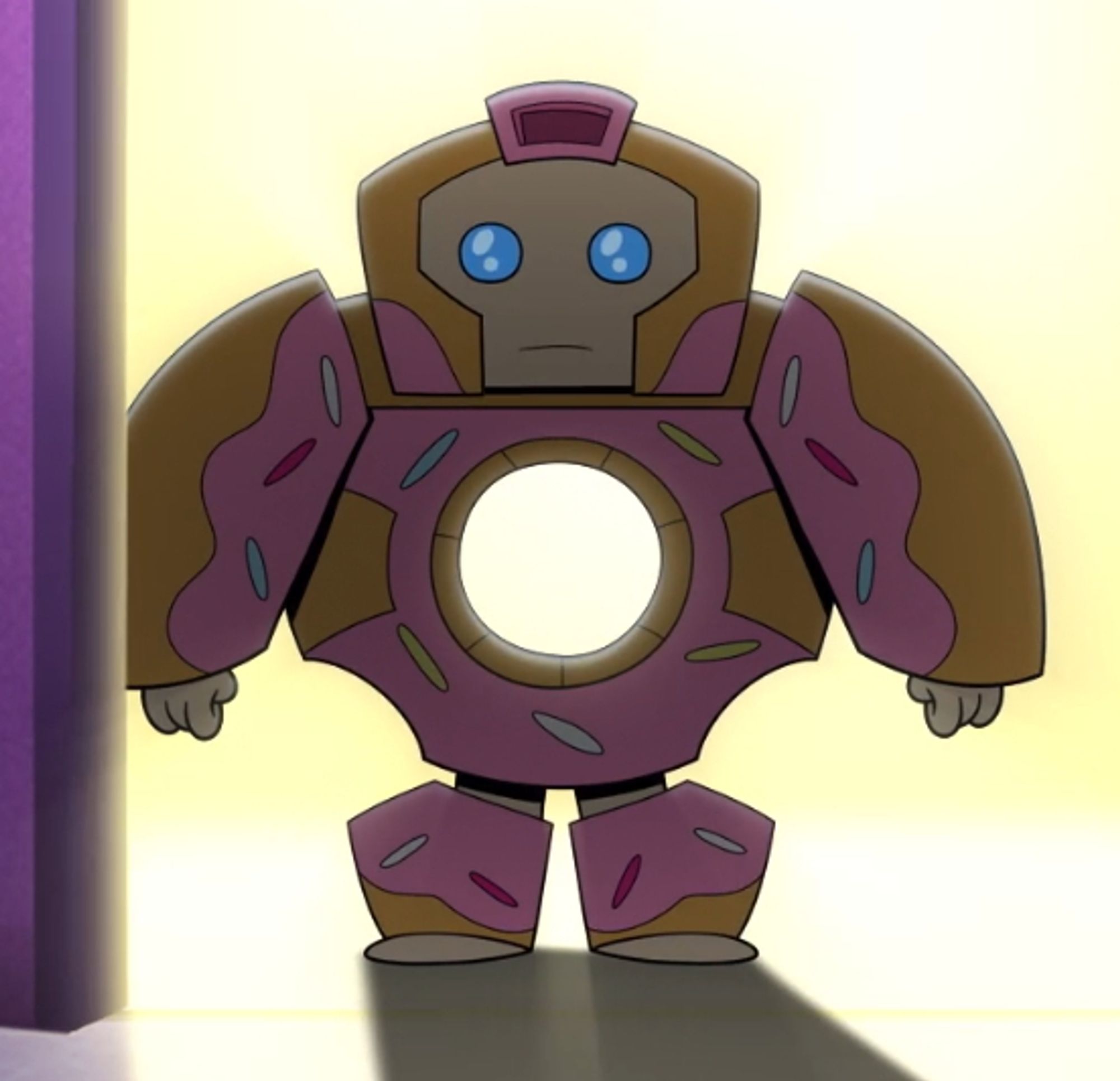 Screen cap from the "Transformers: BotBots" cartoon of Sprinkleberry D'uhnut, a rotund donut robot (complete with pink frosting with sprinkles and a hole through his midsection), staring blackly into the camera, as he usually stares blankly at almost everything.