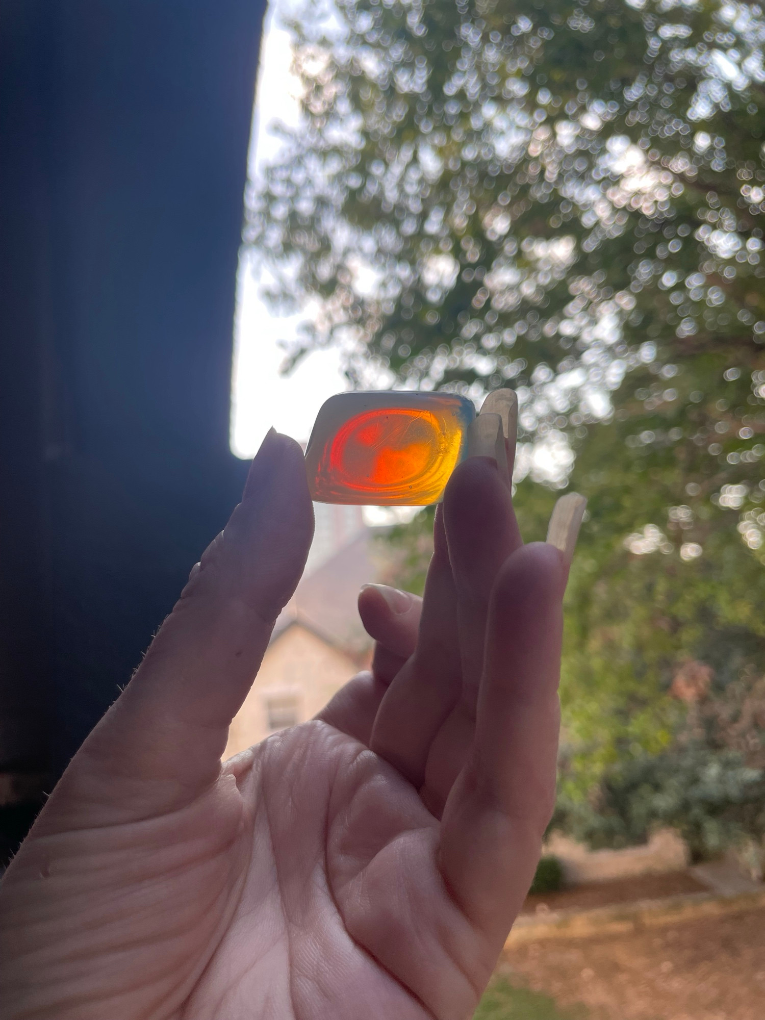 Opalite in the light- a warm amber orange color 