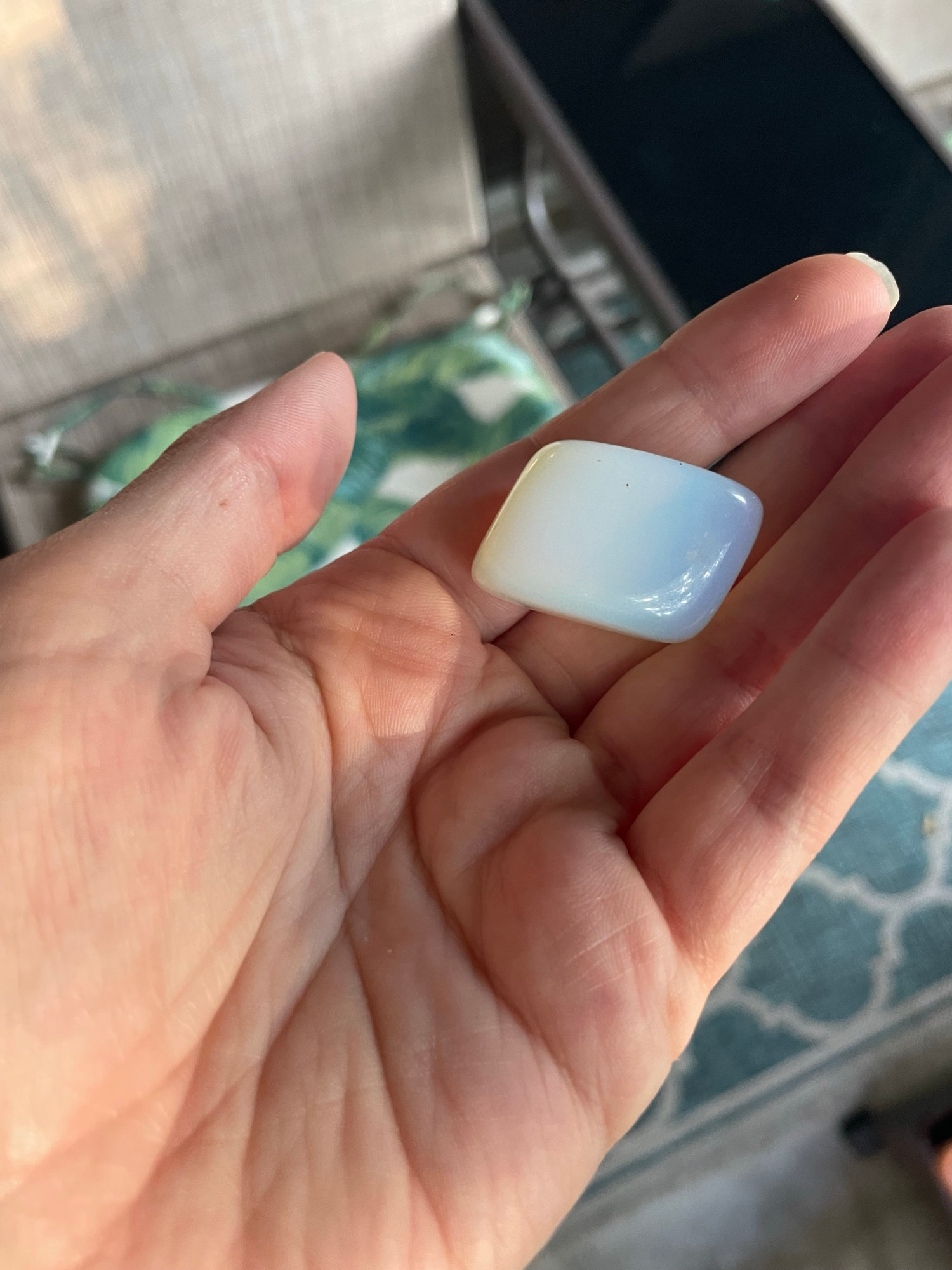 Opalite on my hand, creamy blue colored 