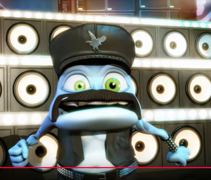 youtube video screenshot
from the video "Crazy Frog - Daddy DJ (Official Video)"
Crazy Frog is on stage wearing leather pants, a leather vest, a leather hat, leather cuffs with studs and belt with studs and a thick handlebar mustache
