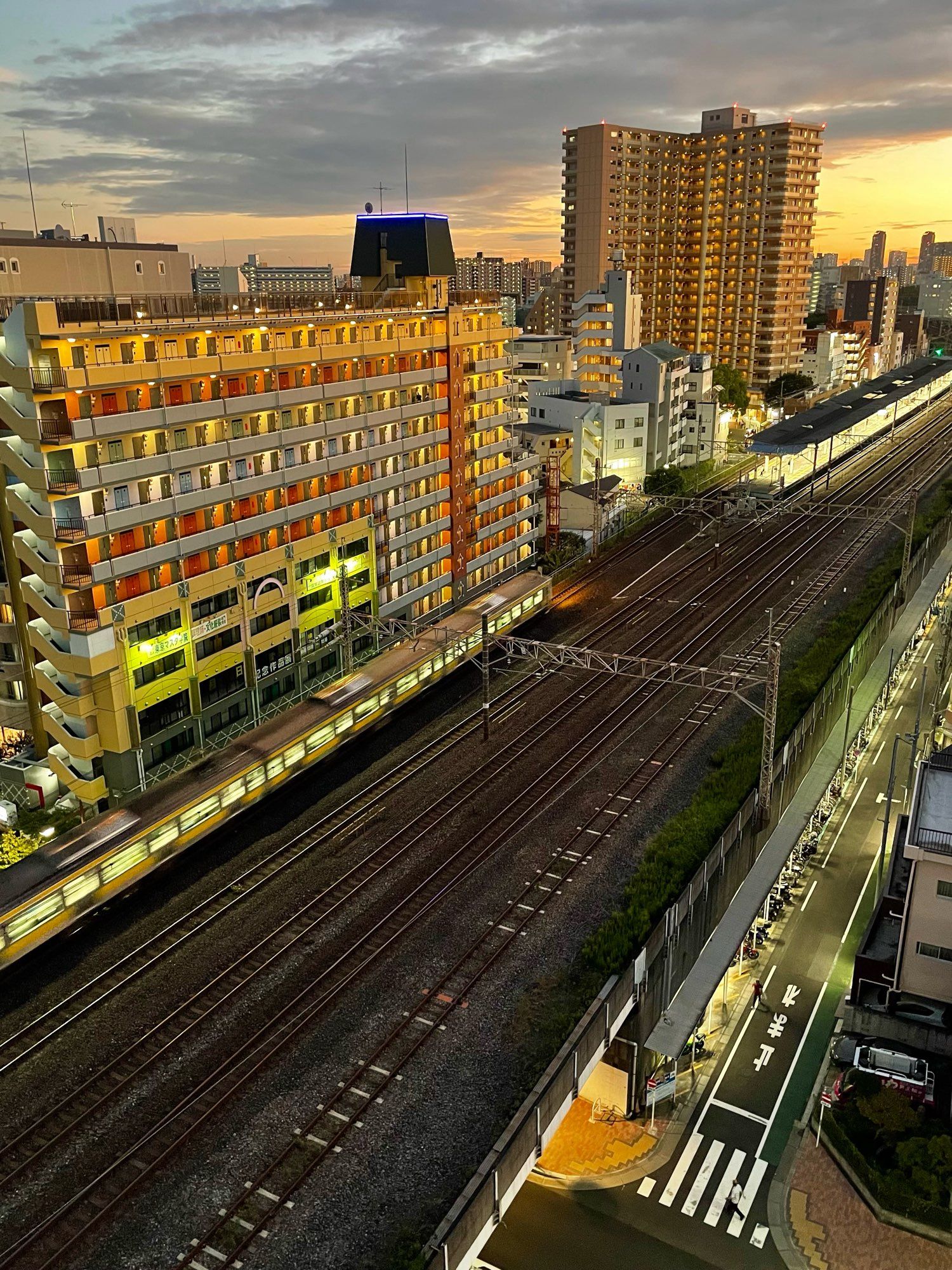 A train arriving at Hirai Station, Tokyo on a nice autumn evening