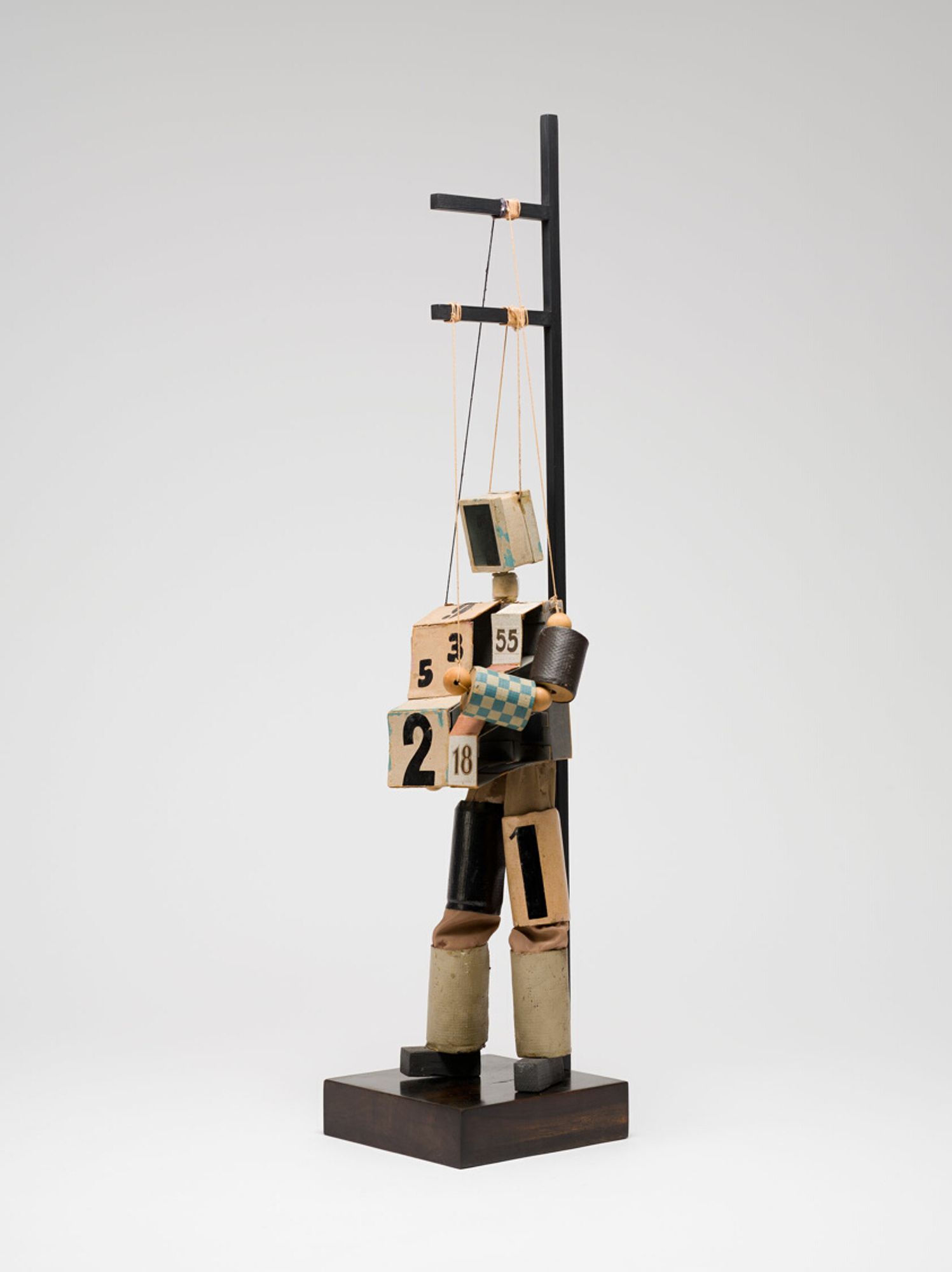 This work is one of a series of marionettes Alexandra Exter made in 1926 for an unrealized film. Her inventive figurines draw on revolutionary artistic developments of the 20th century, including mechanization, nontraditional art materials, assemblage, collage, and abstraction. Exter used glass for the robot’s face to play on the faculty of sight, and she made an accordion of cardboard cubes for the chest to suggest the act of breathing.