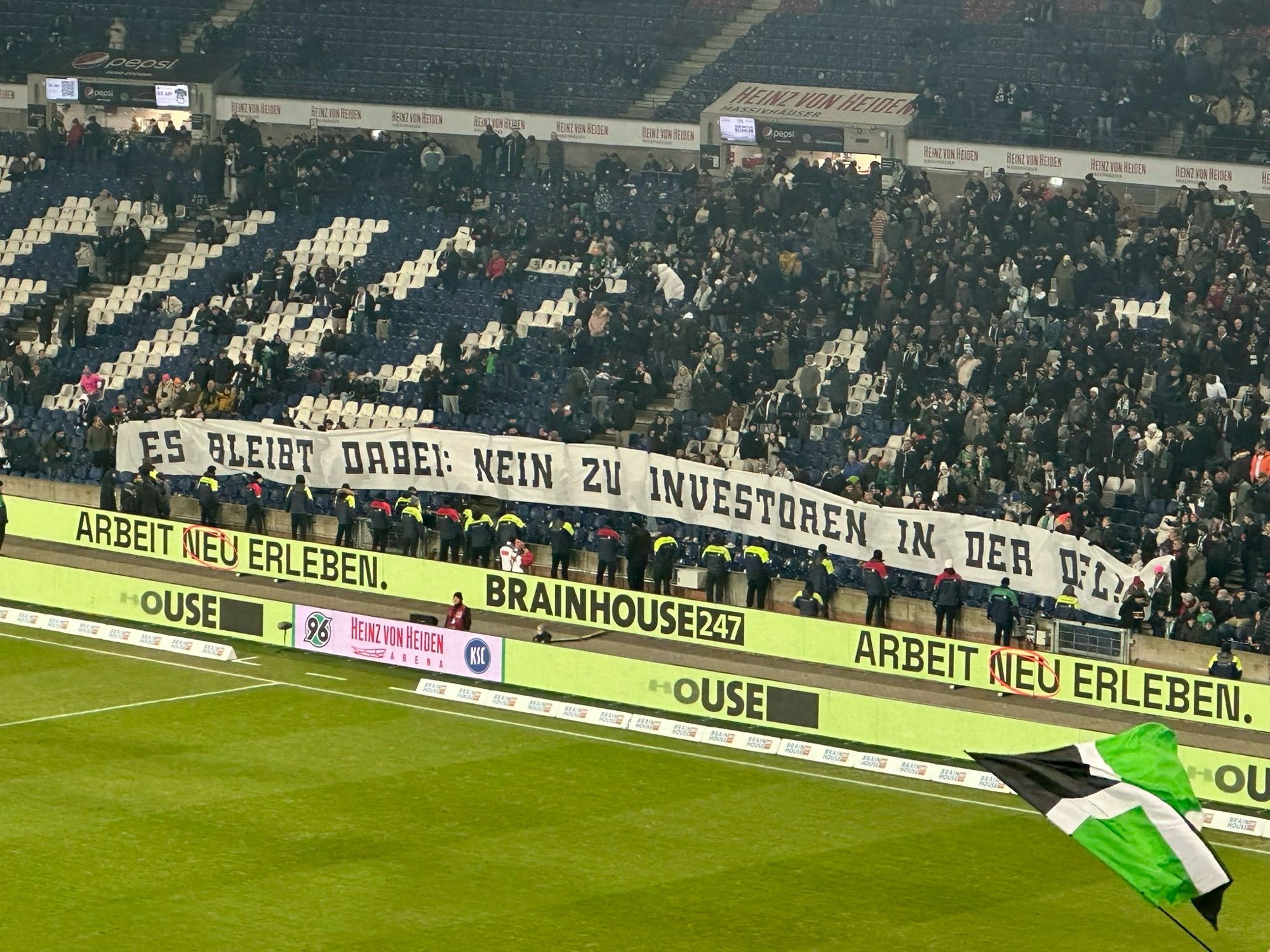 Fans presenting a banner against investment into the German football league.