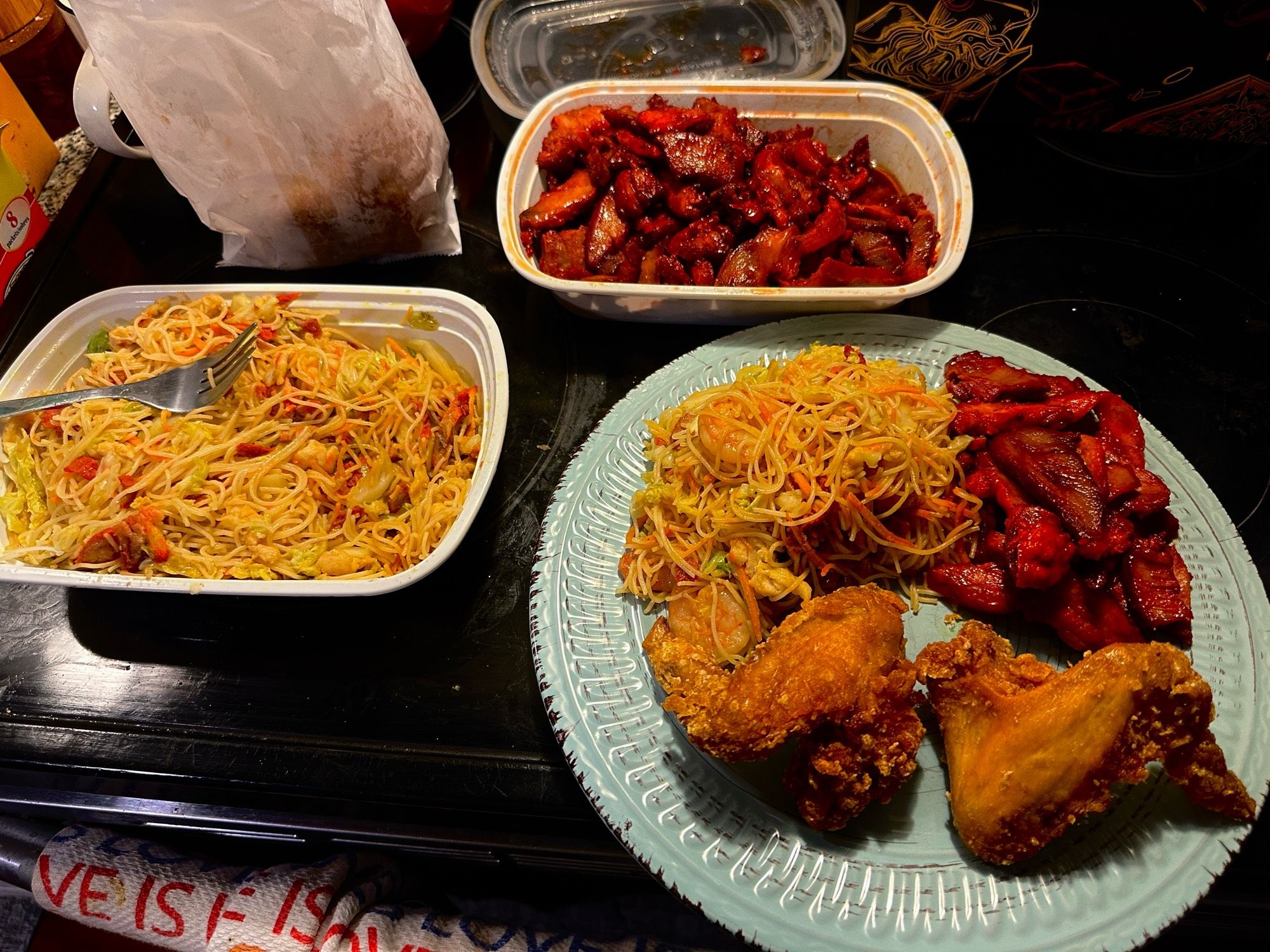 A picture of some Chinese takeout that I ordered.  Singapore chow mei fun (rice noodles), boneless spare ribs, and fried chicken wings.