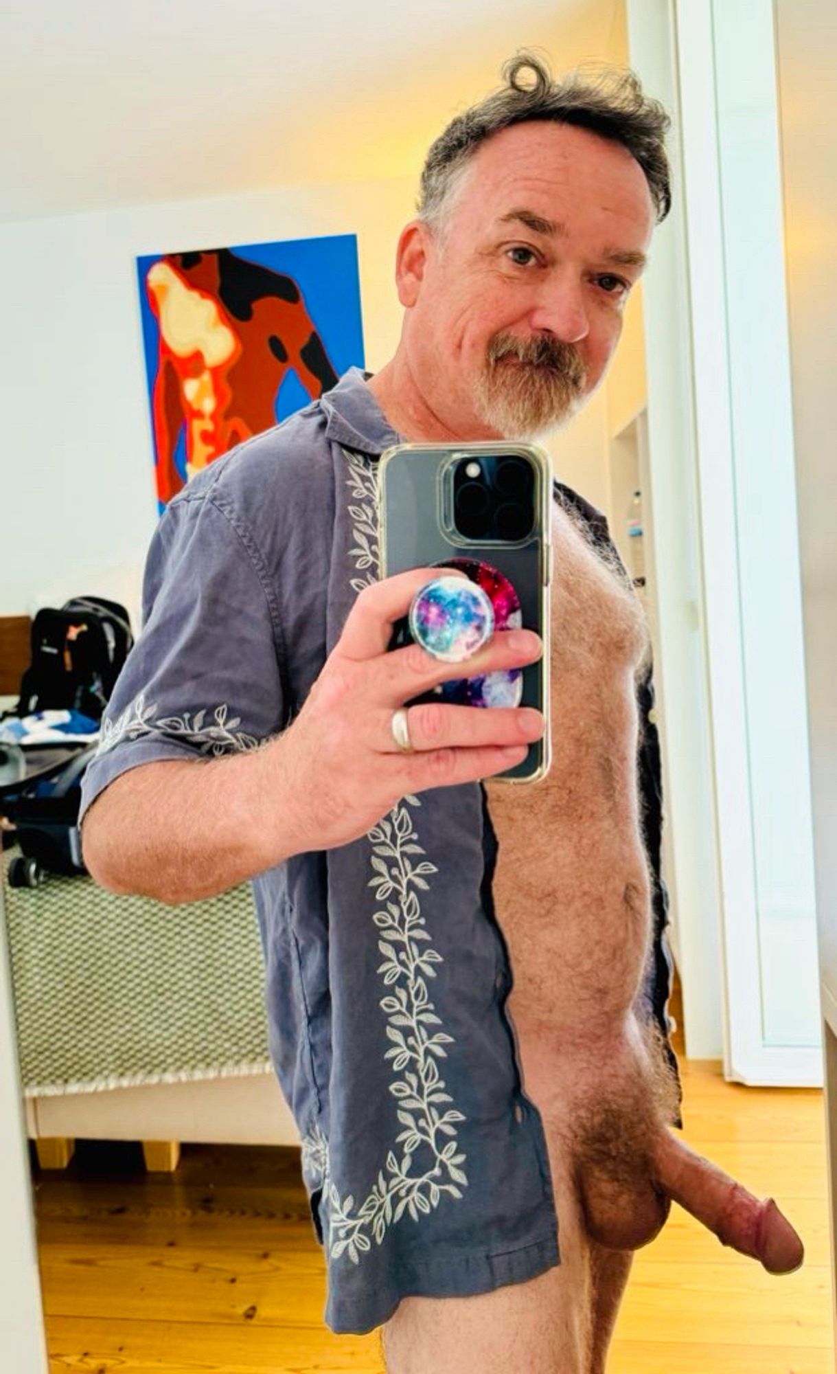 Furry naked Dad wearing only a blue unbuttoned shirt with white floral trim and talking a selfie in the mirror to show off his fat dick on Fat Cock Friday.