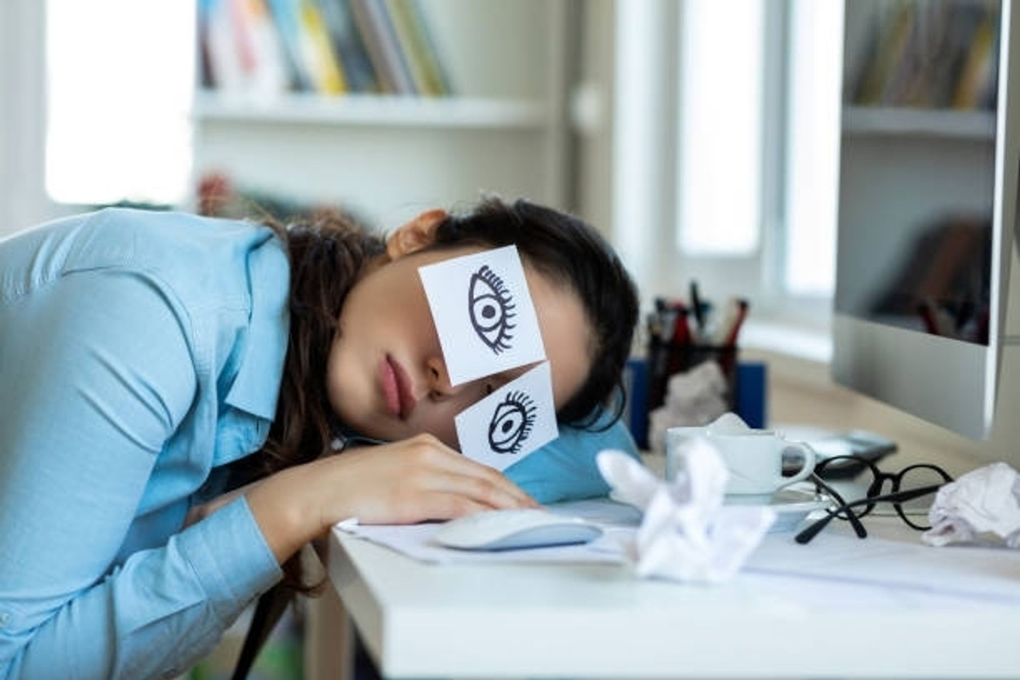 a nice lady lying over her desk with post-its over her eyes, with eyes drawn on them. she just needs more sleep, she'll be more into things another day. she assures me it's not me...