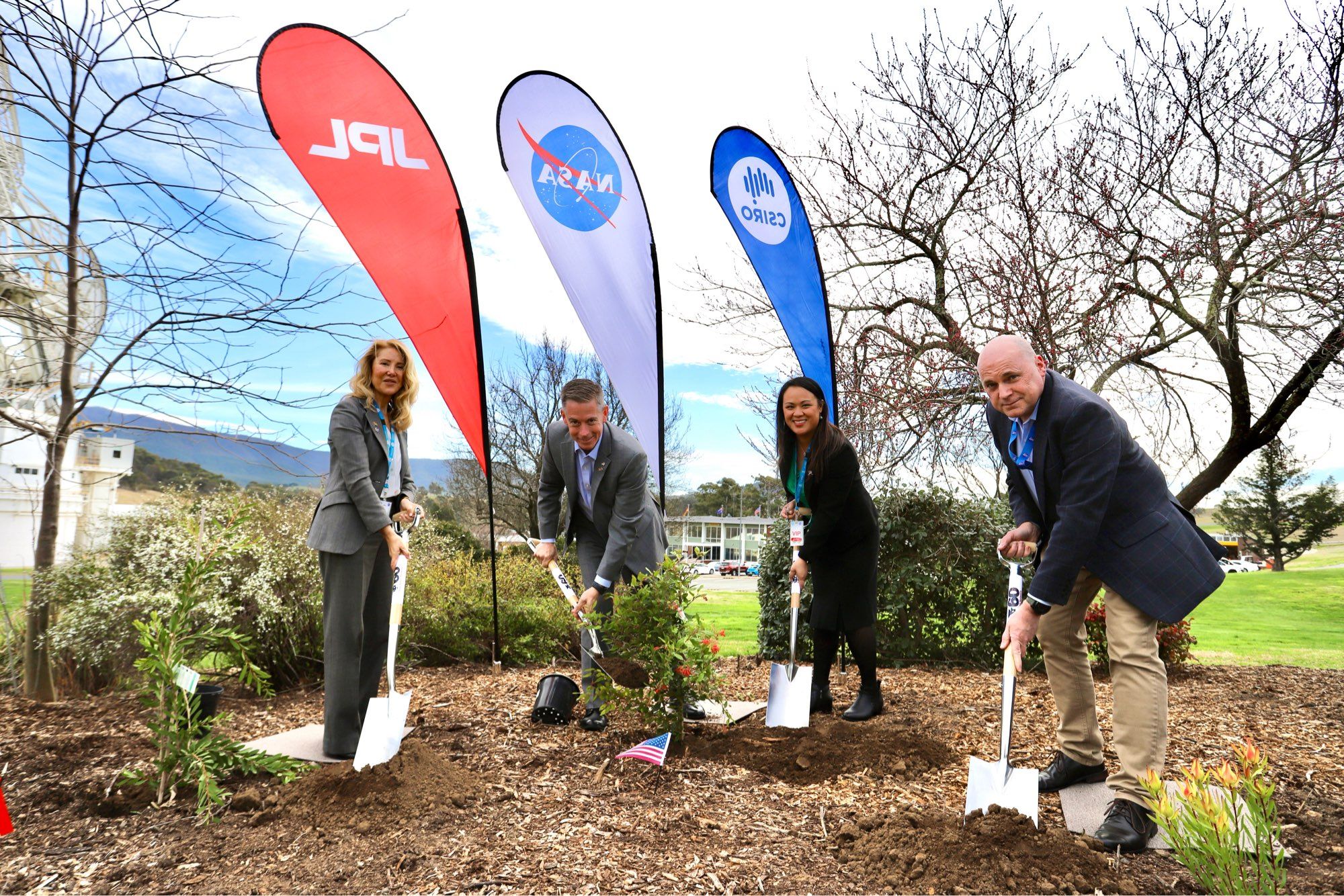 Left to right: Ms Montserrat Momán Pampillo – Chargé d’Affaires, Spanish Embassy in Canberra; Mr Kevin Coggins – Deputy Associate Administrator, Space Communications and Navigation (SCaN); Ms Vanna Lavery – acting Economics Counsellor; and Mr Kevin Ferguson – Director, CSIRO Canberra Deep Space Communication Complex plant three native plants during the 60th anniversary celebrations for the Deep Space Network.