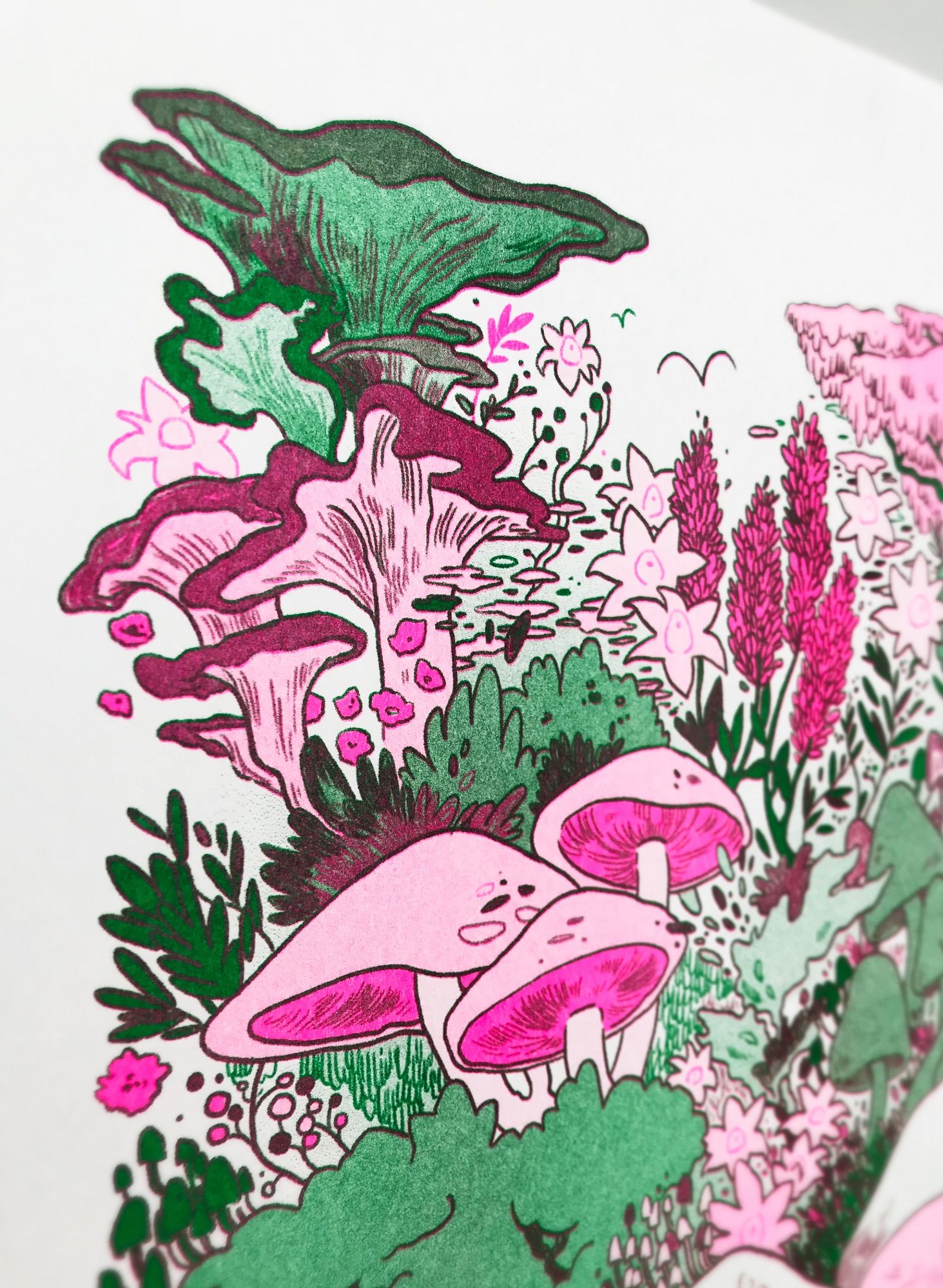 close up of pink and green riso print