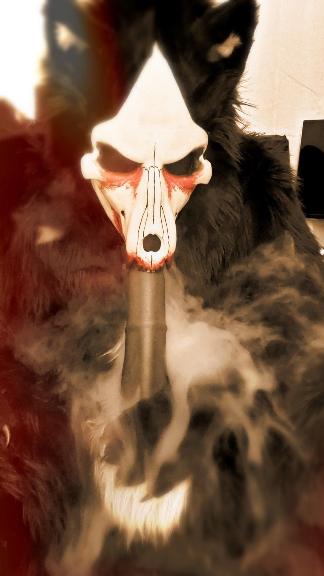 Skulldog, smoke pouring from his mouth, leaning forward to take his horsecock into his mouth