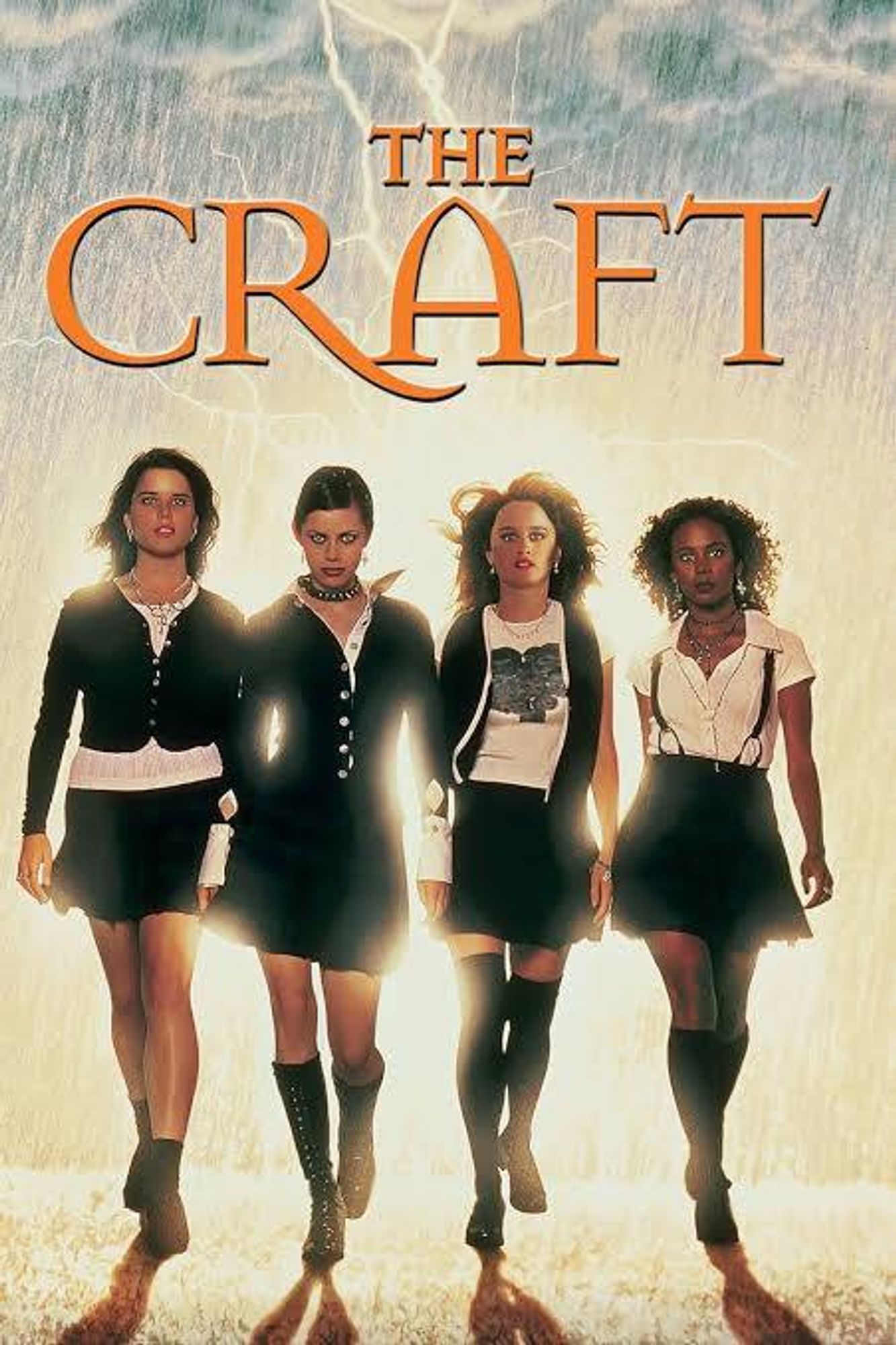 Promotional post for THE CRAFT. Four teenage girls blasted by bright light from a lightning bolt behind them, walk confidently through a rainstorm as their hair blows in the wind. Each one is dress in a unique outfit, but they are all black and white in color and have a very short skirt.