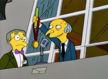 mr. burns bestows a medal upon an inanimate carbon rod