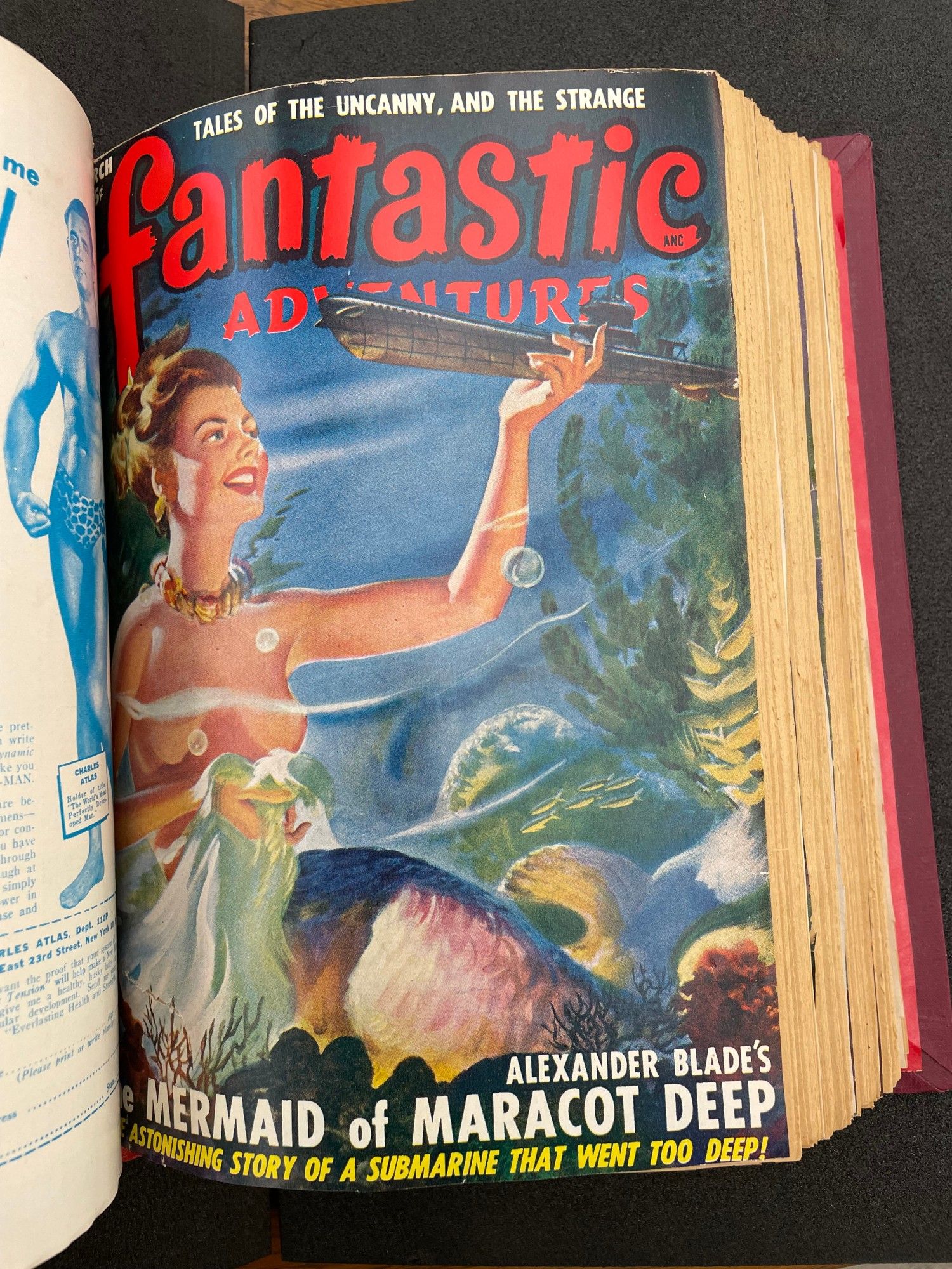 March 1945 issue of pulp magazine Fantastic Adventures featuring a topless mermaid sitting underwater and holding a ship in her left hand.