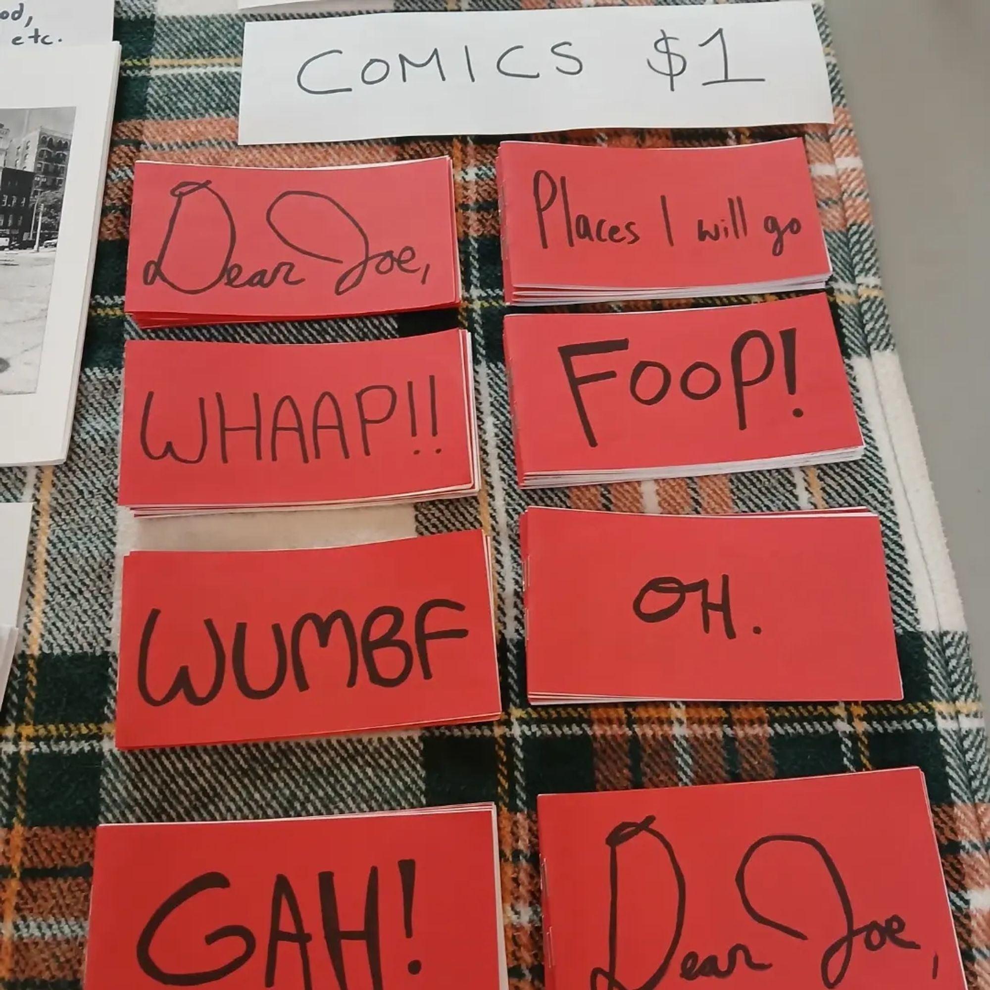 Comics $1! Red covers with titles like Foop! GAH Dear Joe, and OH.
