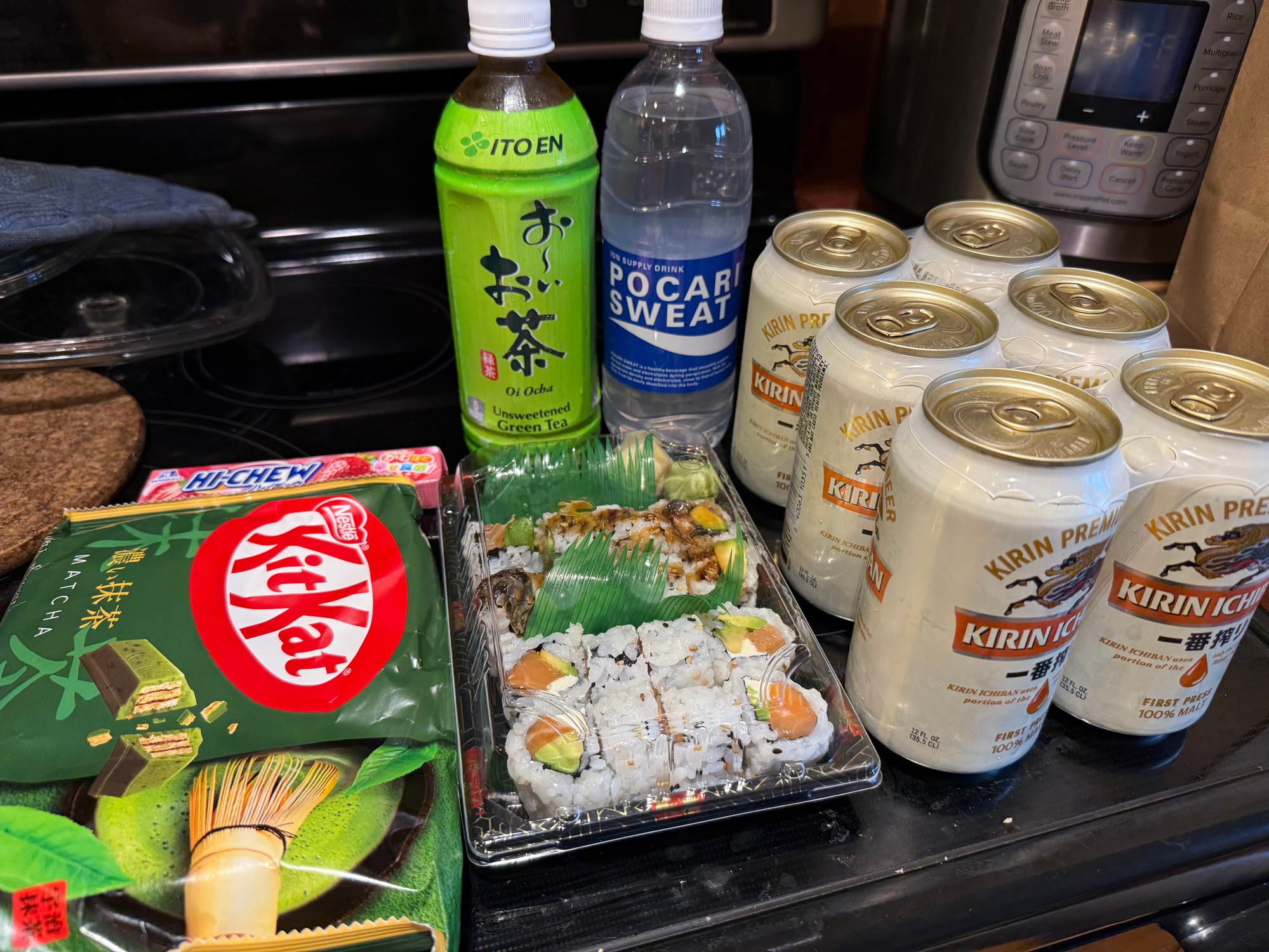 Arthur’s dinner. Matcha Kit Kat, Strawberry Hi Chew, Ito En unsweetened green tea, Pocari Sweat, Kirin Ichiban beer, and sushi
