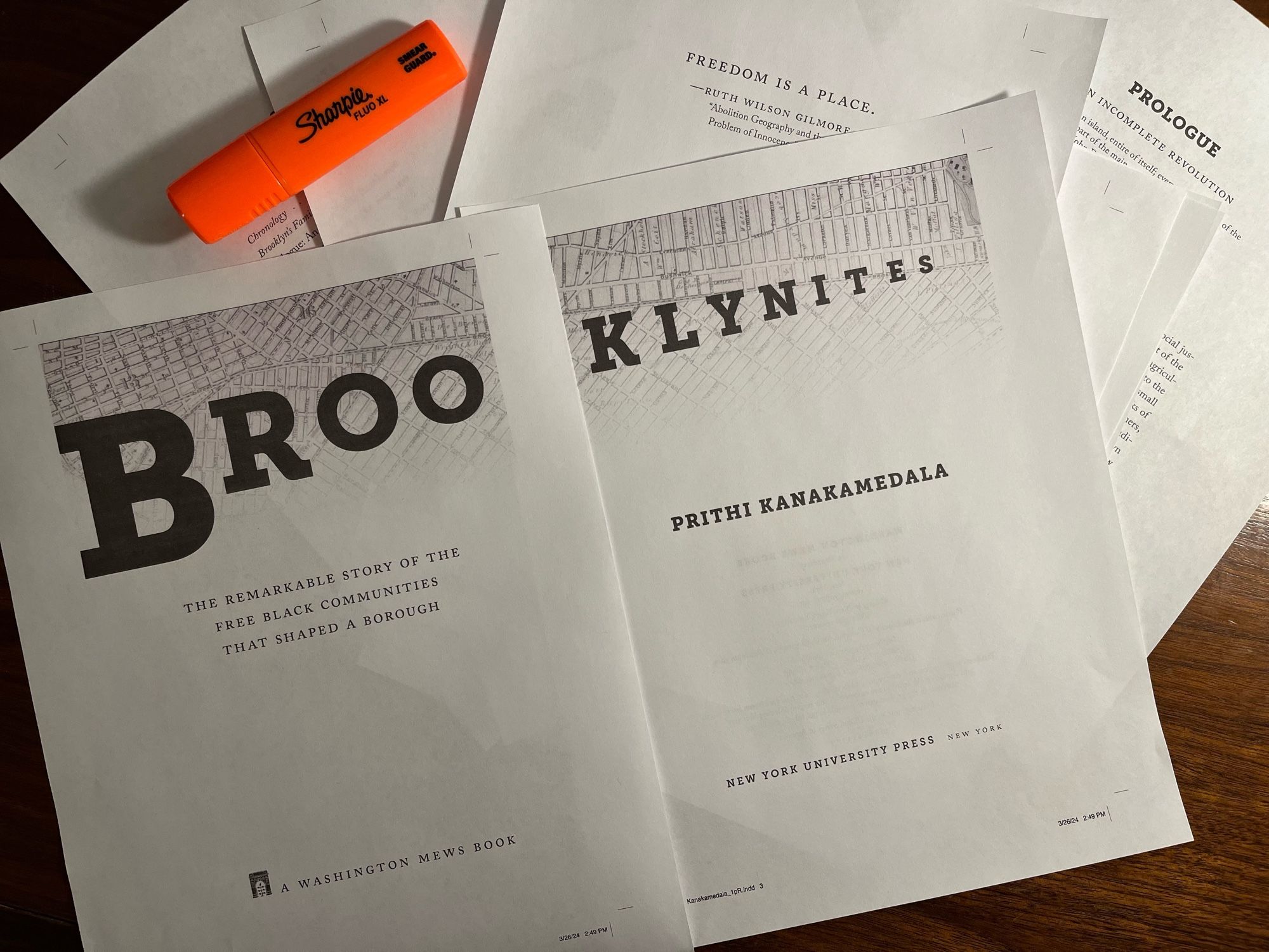 Book proofs for Brooklynites: the remarkable story of the free Black communities that shaped a borough are placed on a desk. A highlighter is on the top left of the image.