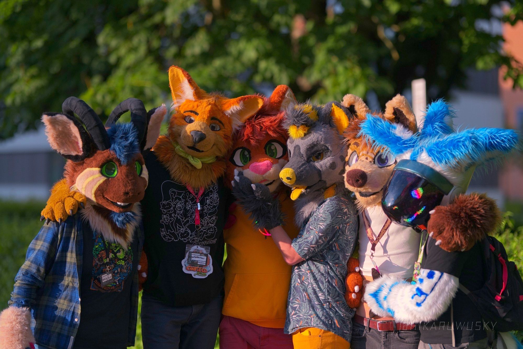 A bunch of nerdy furries posing for a group picture