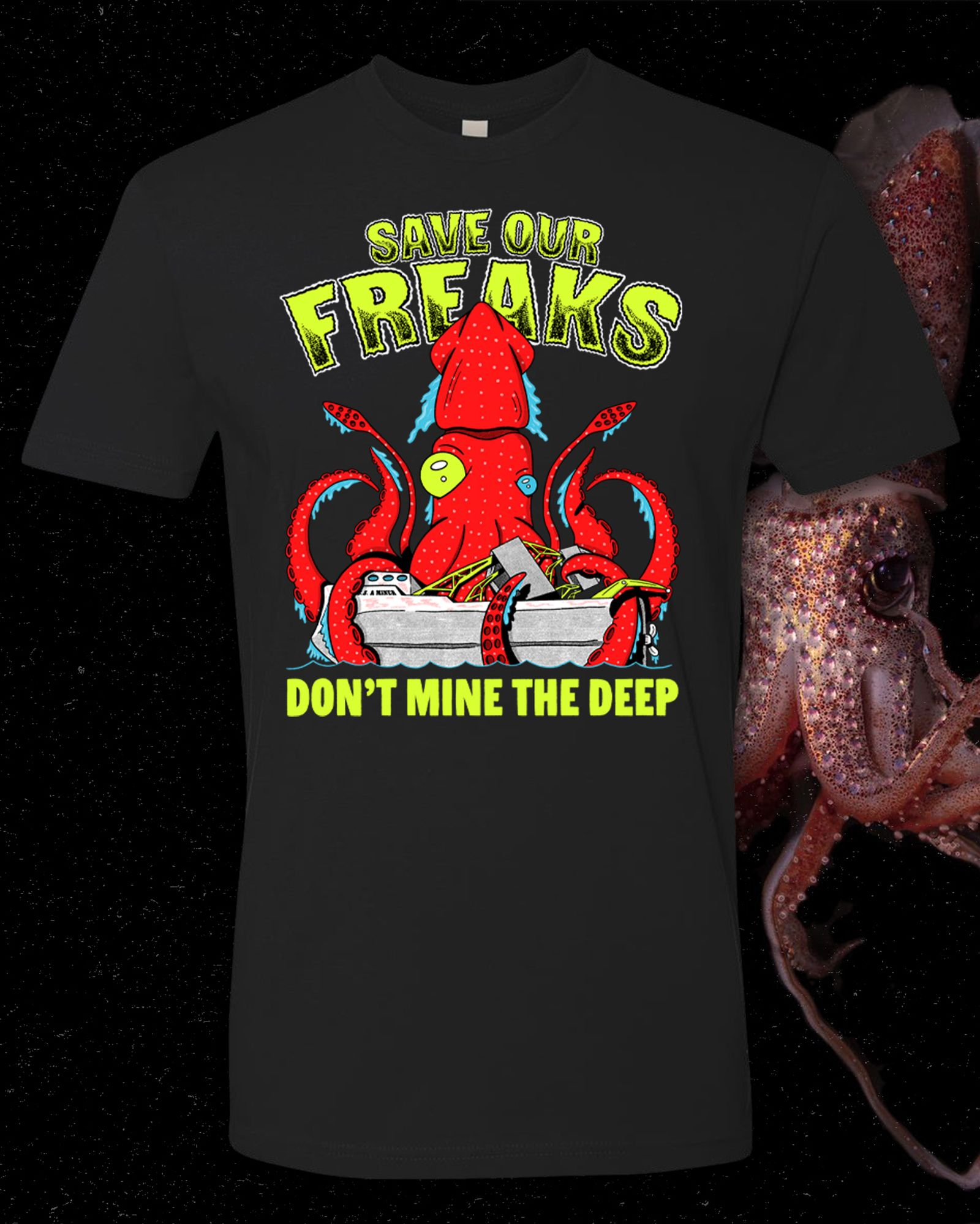 A black t-shirt with a strawberry squid sinking a mining ship with yellow letters that say “save our freaks don’t mine the deep”