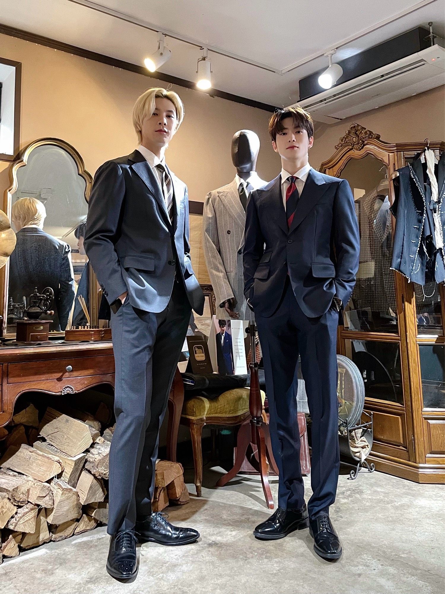 Johnny and Jaehyun posing in their custom suits during an episode of Johnny’s Communication Center.