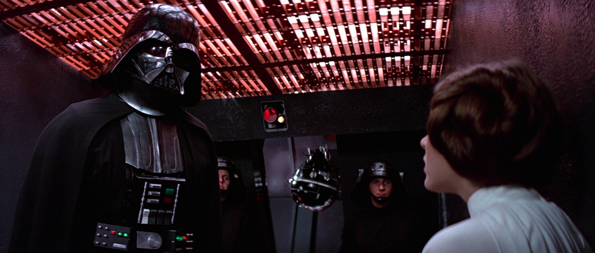 Princess Leia confronts Darth Vader, who is trying to interrogate her. She will not yield!