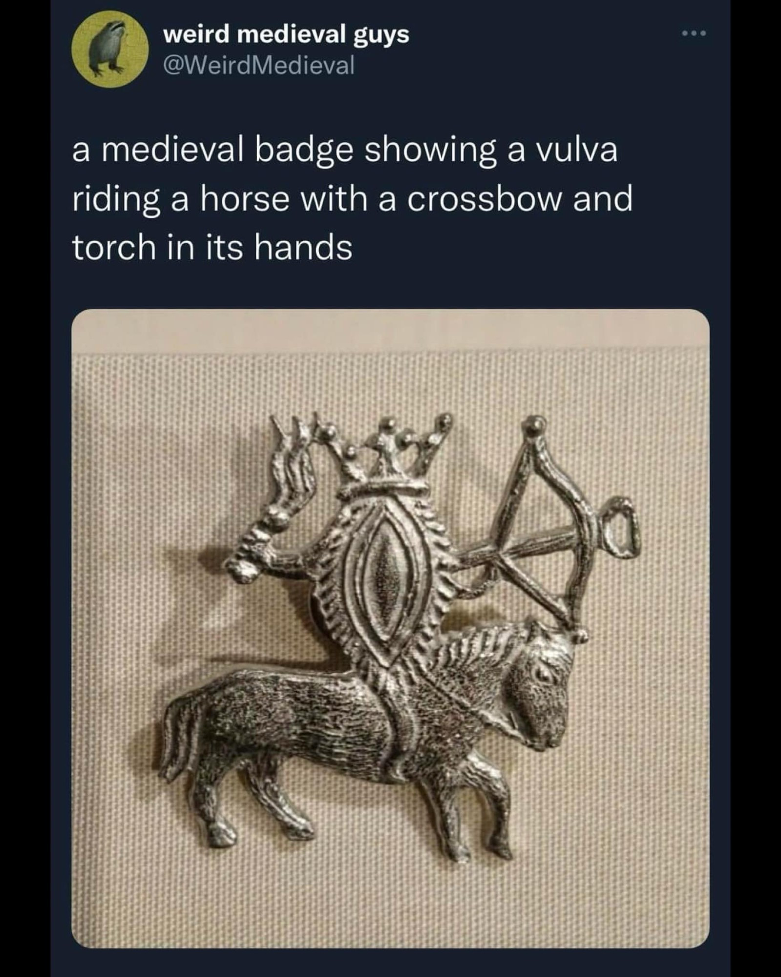 A medieval badge showing a vulva riding a horse with a crossbow and torch in its hands @weirdmedieval