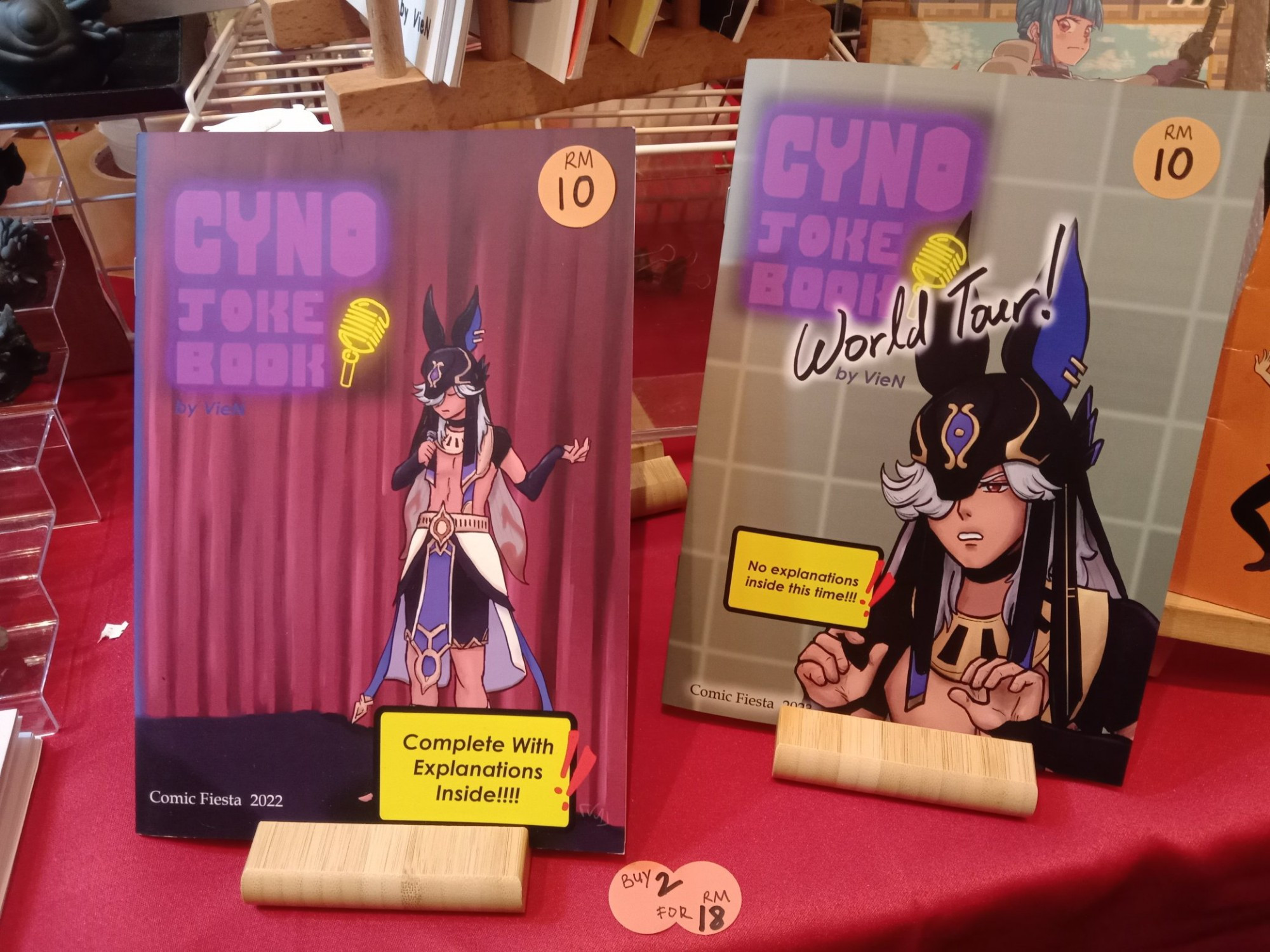 Two Genshin Impact unofficial fanbooks titled Cyno Joke Book and Cyno Joke Book World Tour.