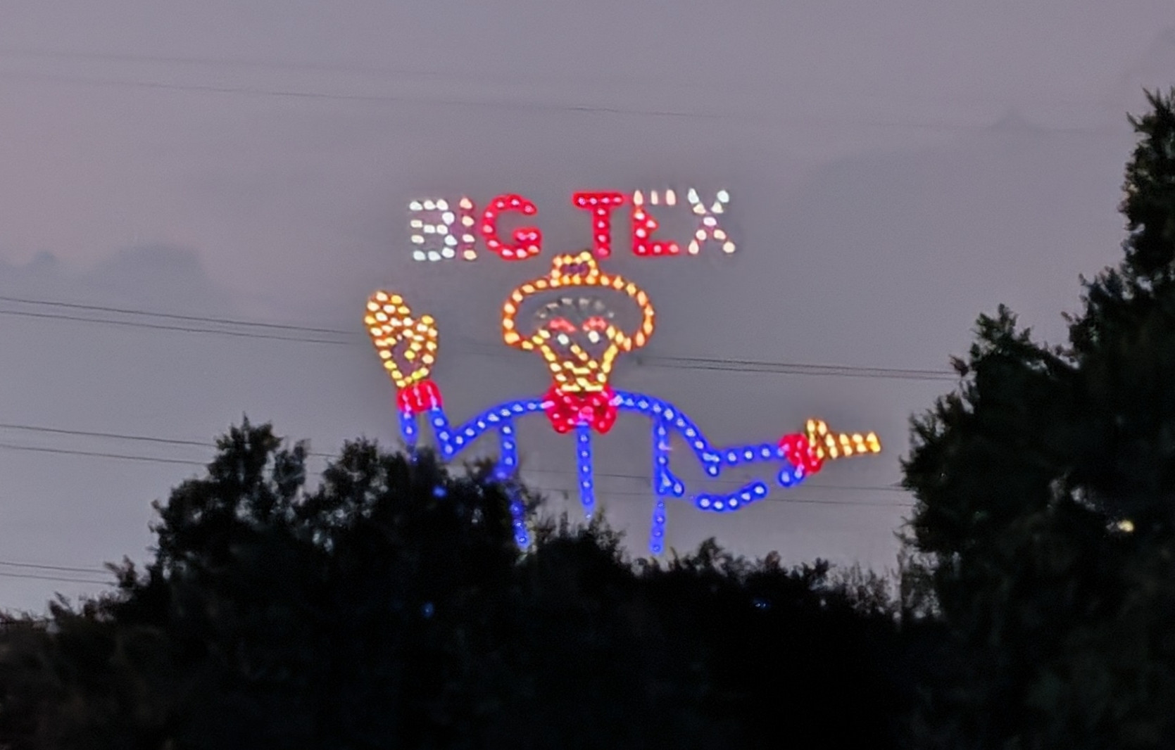 Drones creating the figure of Big Tex in the sky 