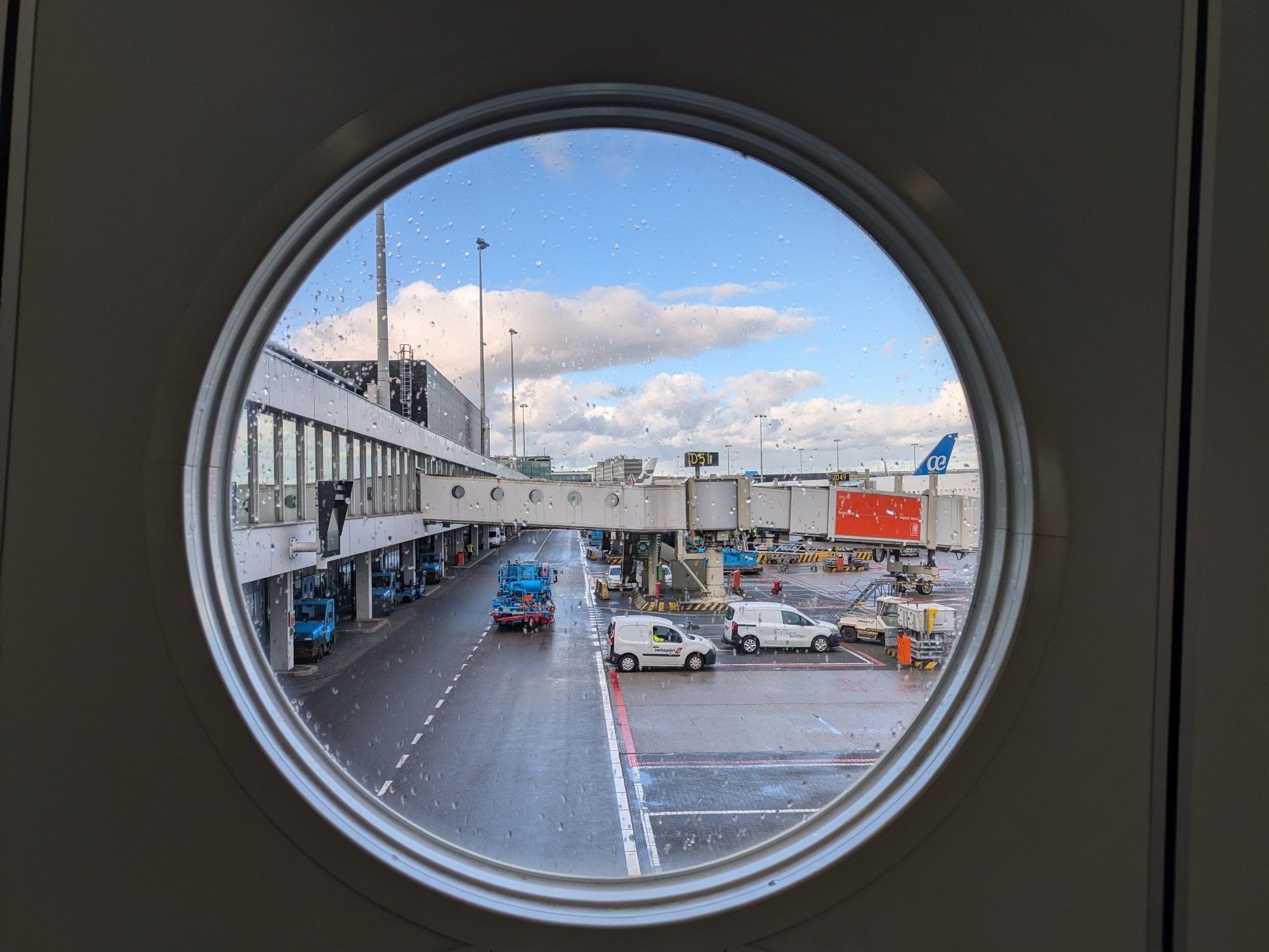 Airport view through a round window