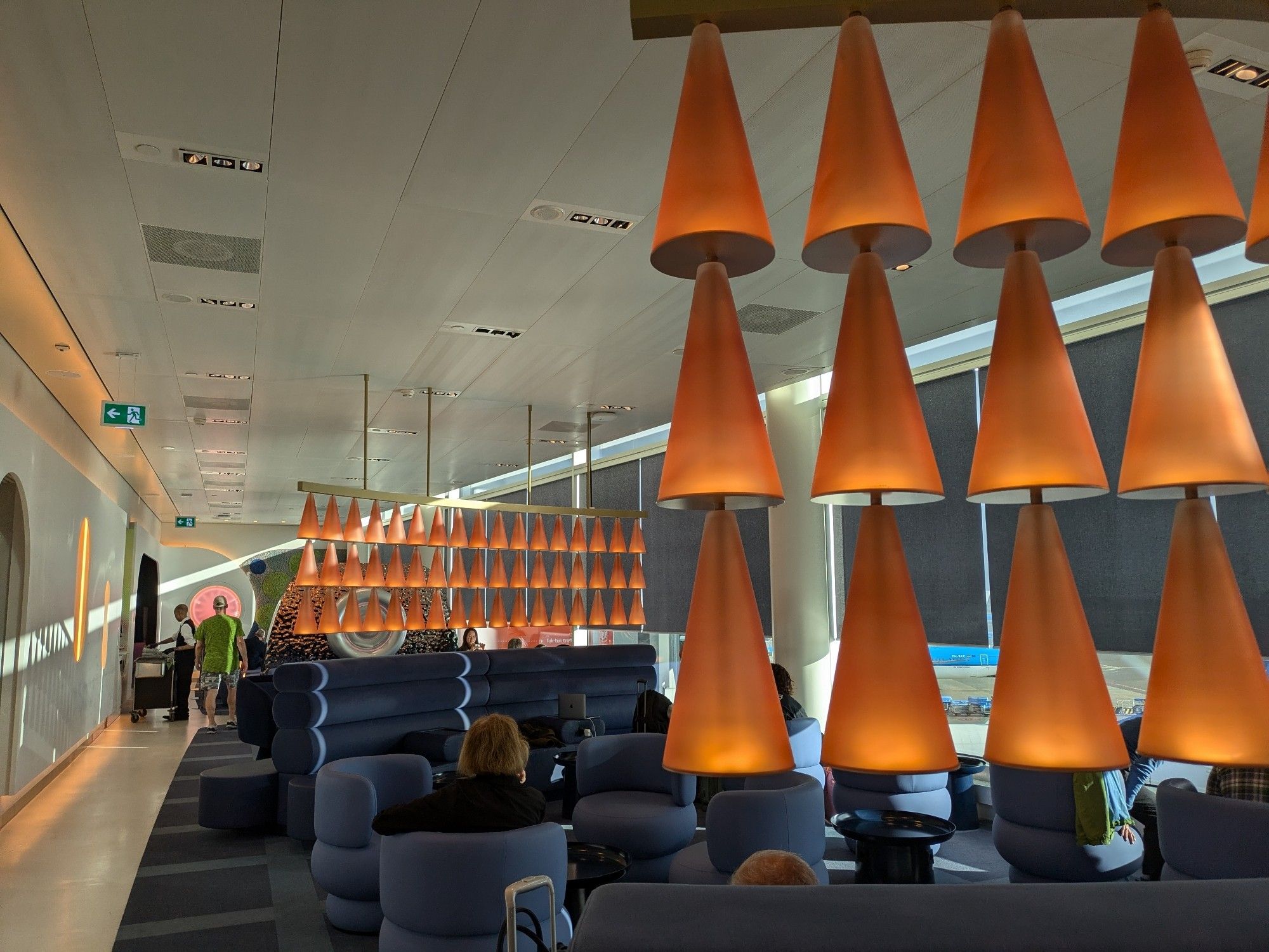 Golden bell lamps hanging in an airport lounge