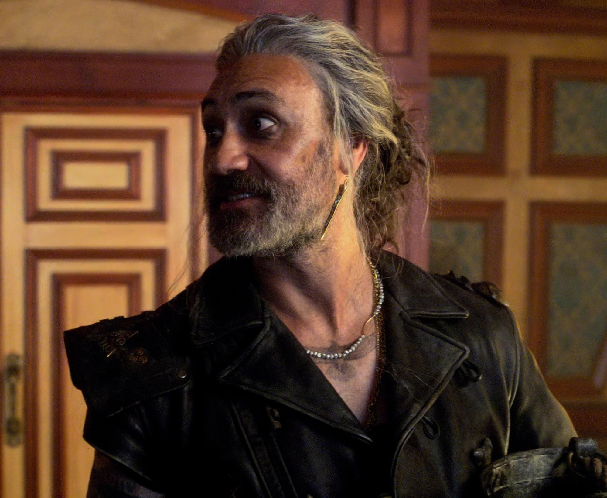 ed teach in the cabin on the revenge after having a very rough night that totally got all the poison out of his system, ed's holding a bucket for tidying up and has his hair up in a messy bun (our flag means death s2e2)