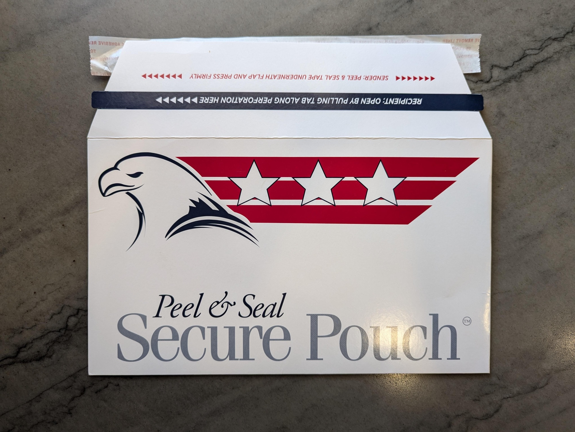 A ballot-sized envelope with an eagle, stripes, and stars along with the text "Peel & Seal Secure Pouch"